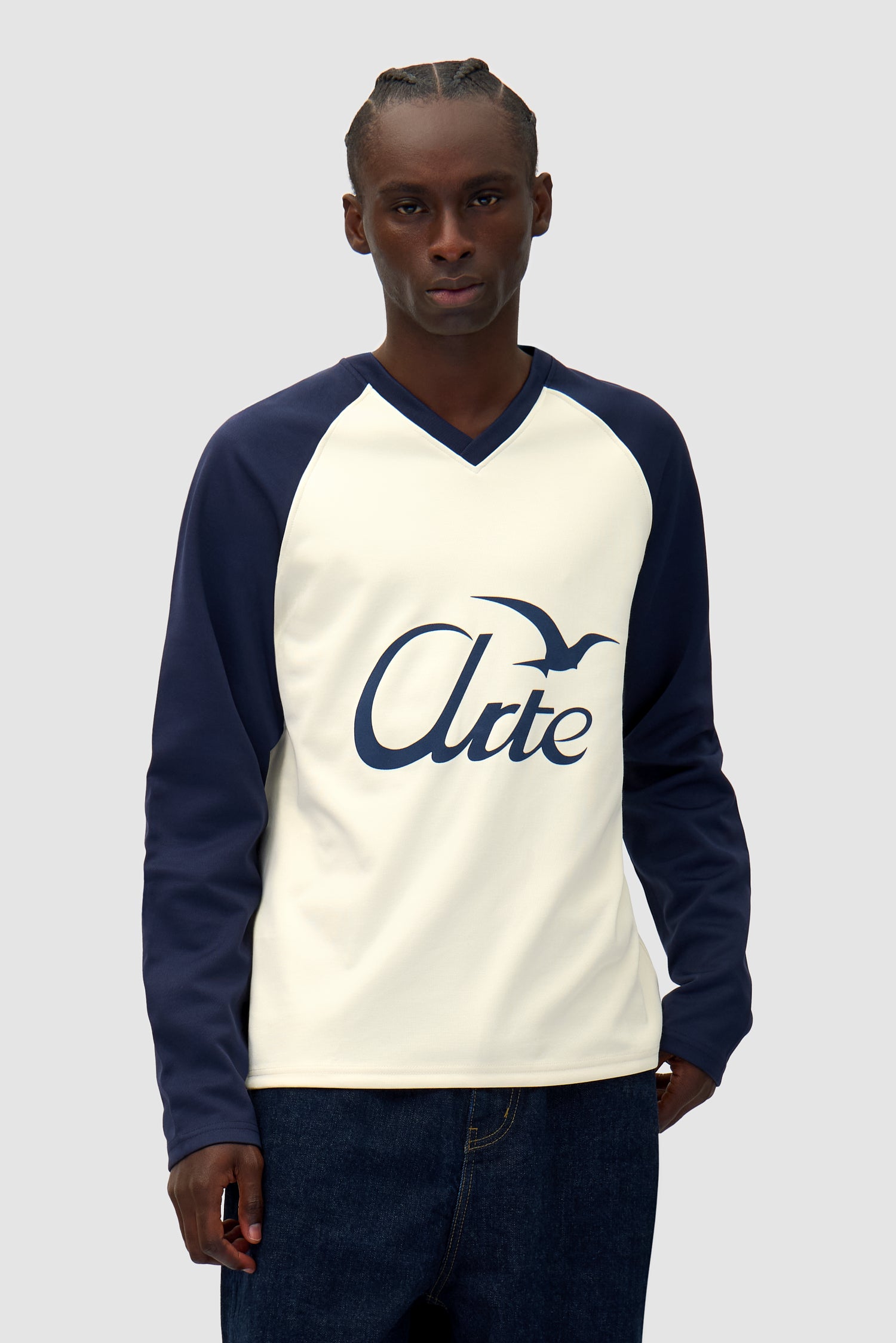 Bird Logo Longsleeve in Navy/Cream worn by a model, half-body front view