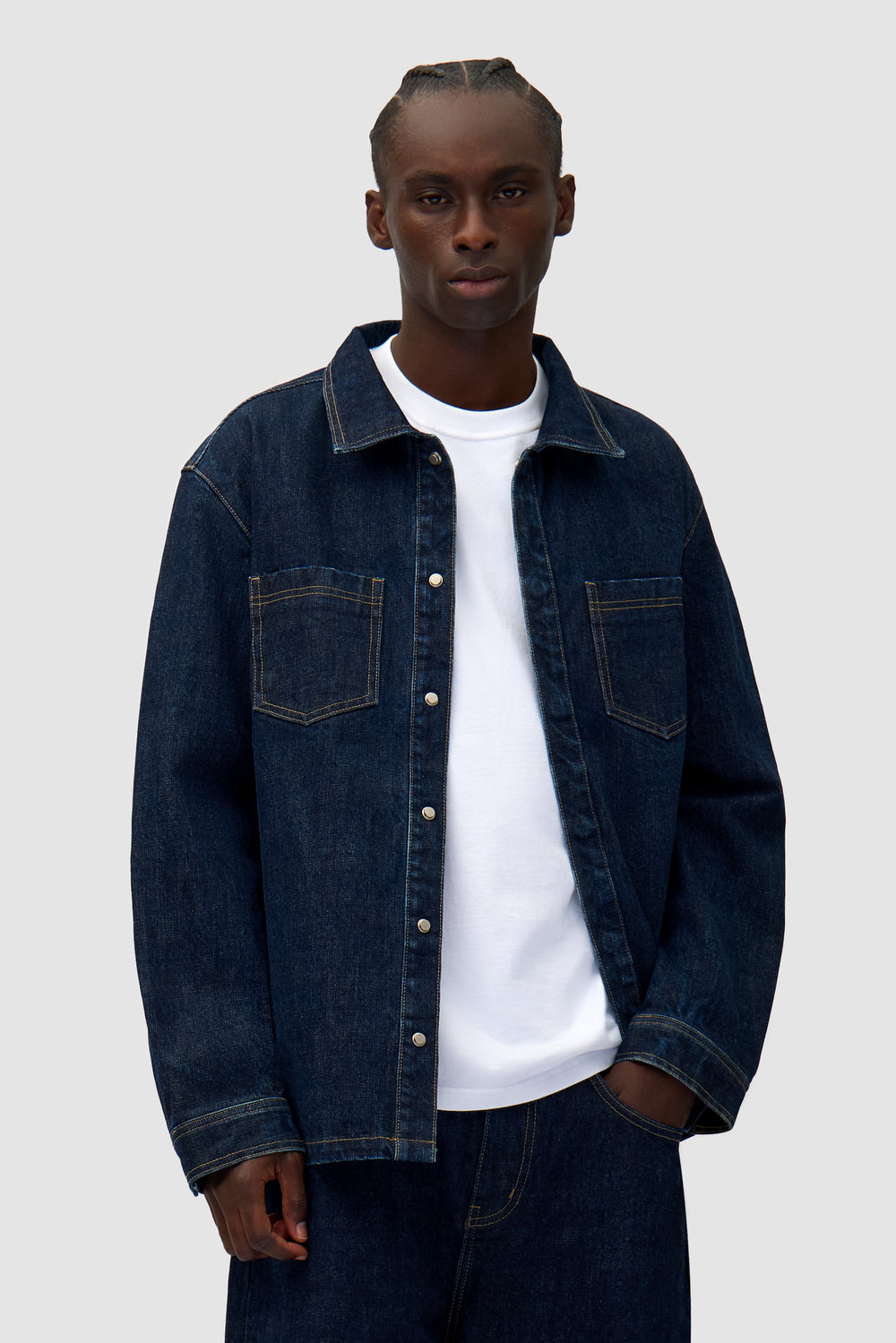 Oversized Denim Shirt in Dark Wash worn by a model, half-body front view