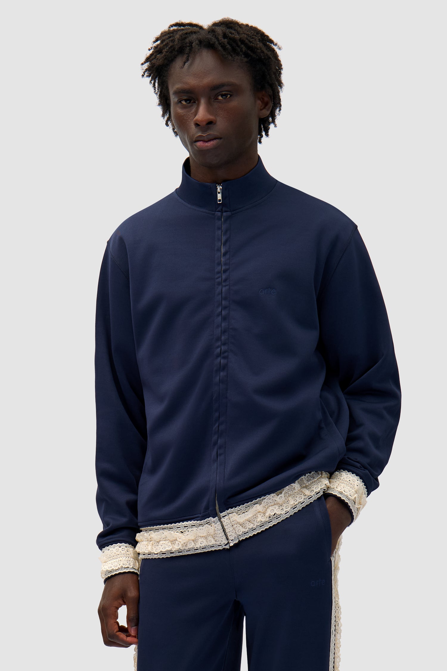 Trim Jacket in Navy worn by a model, half-body front view