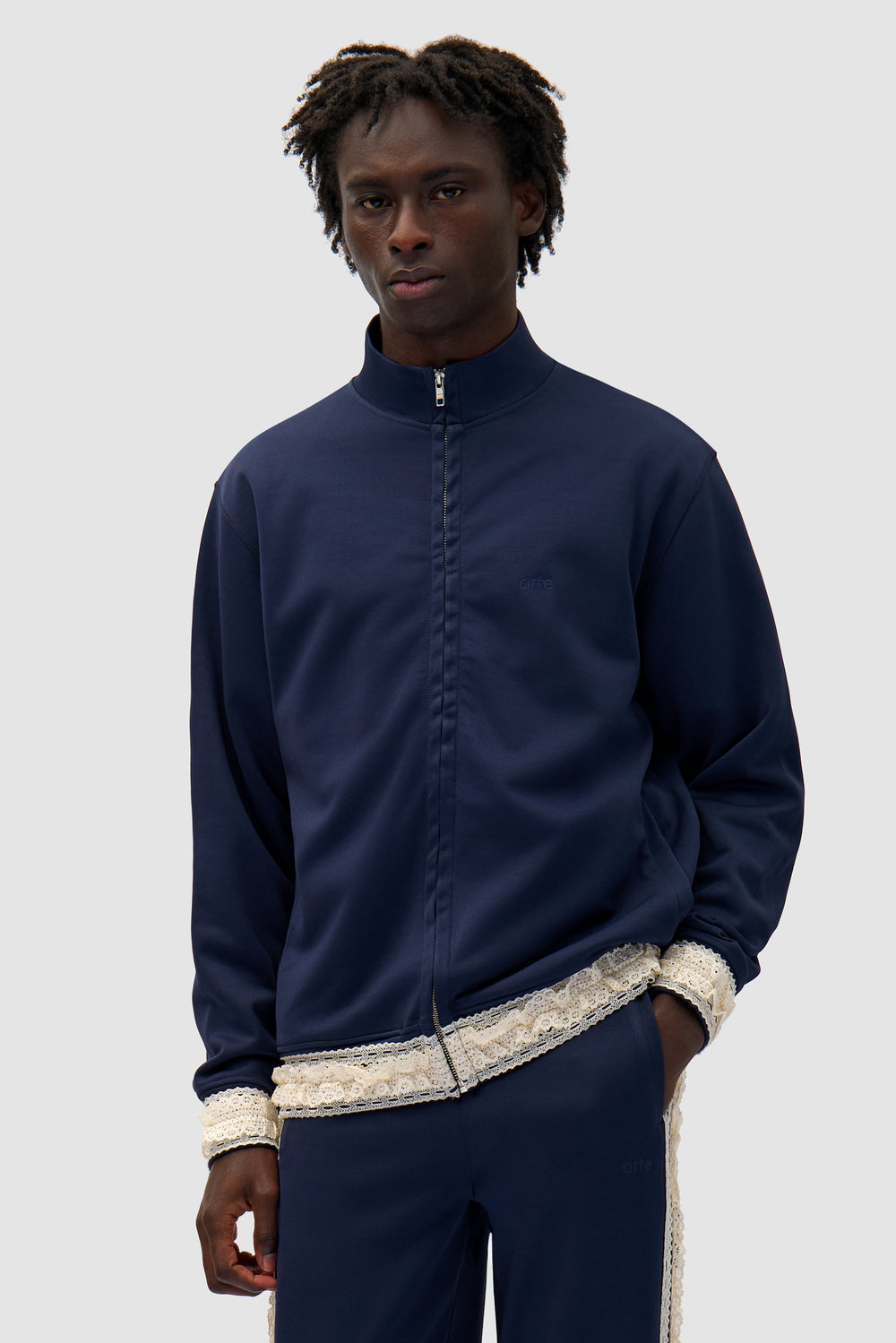 Trim Jacket in Navy worn by a model, half-body front view