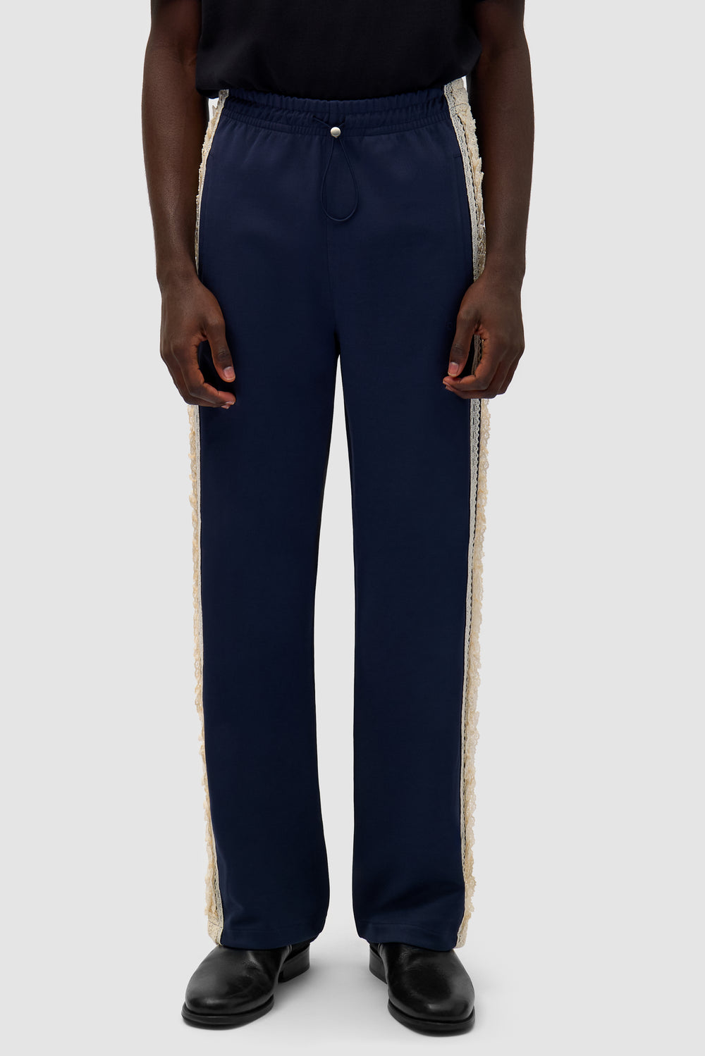 Trim Pants in Navy worn by a model, half-body front view