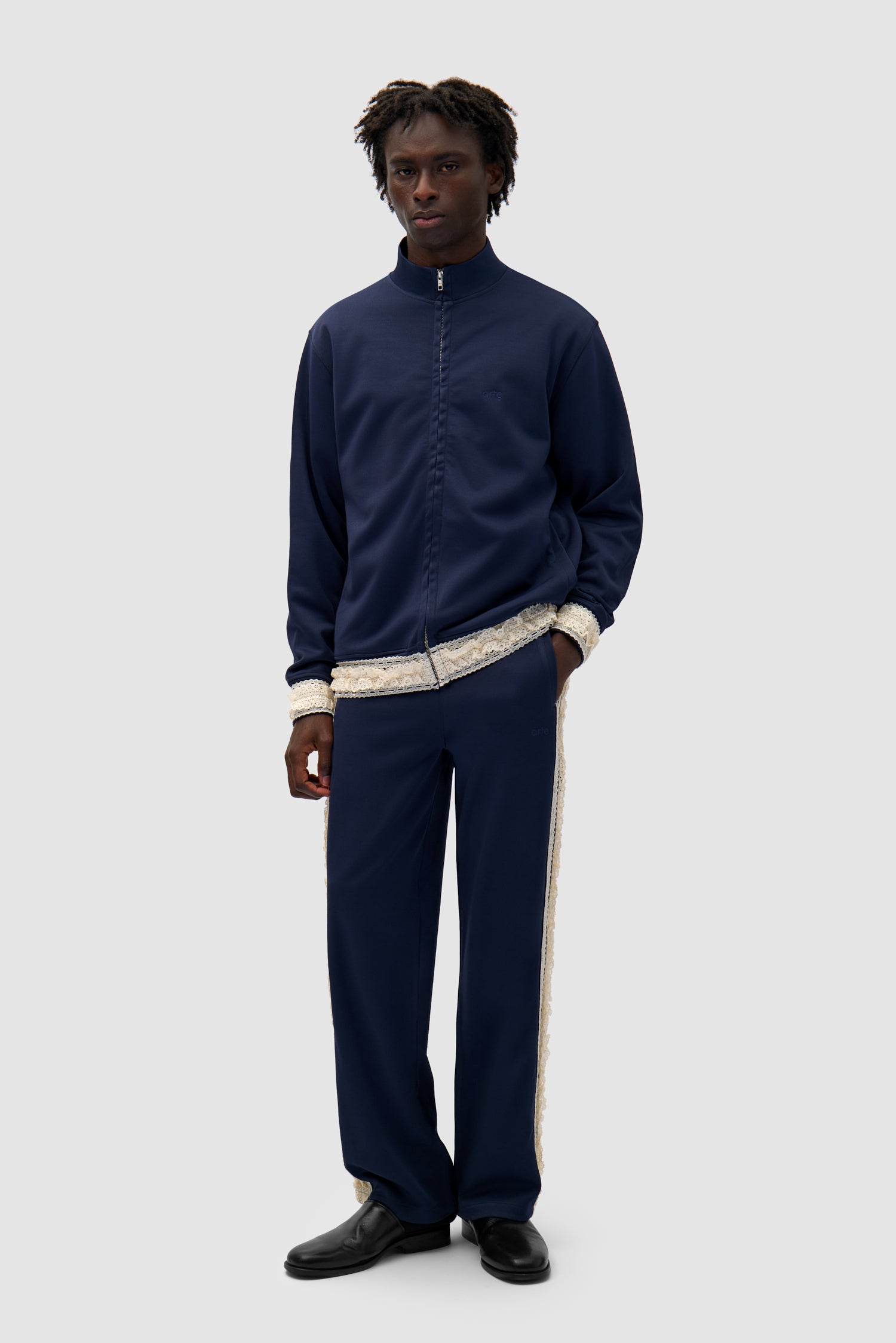 Trim Pants in Navy worn by a model, full-body front view