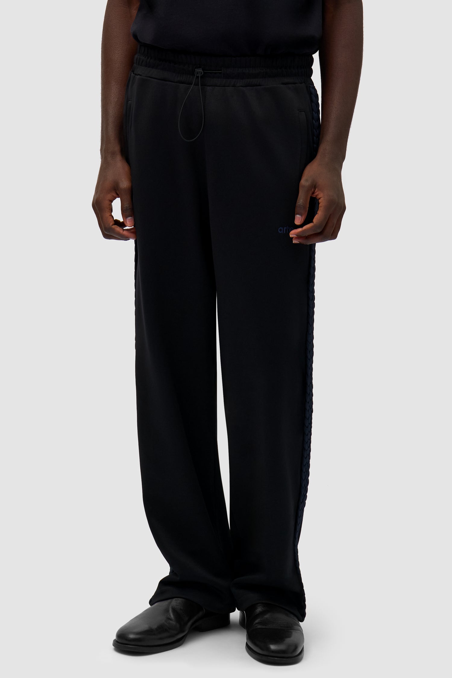 Braid Strip Pants in Black worn by a model, half-body front view