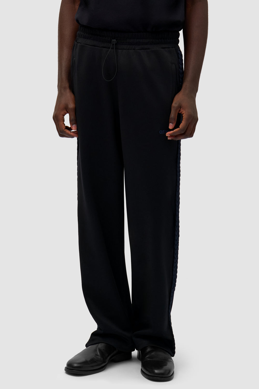 Braid Strip Pants in Black worn by a model, half-body front view
