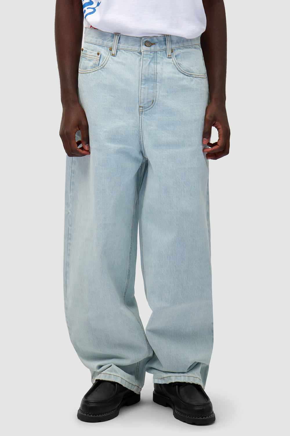 Denim Pants in Bleached Denim worn by a model, half-body front view