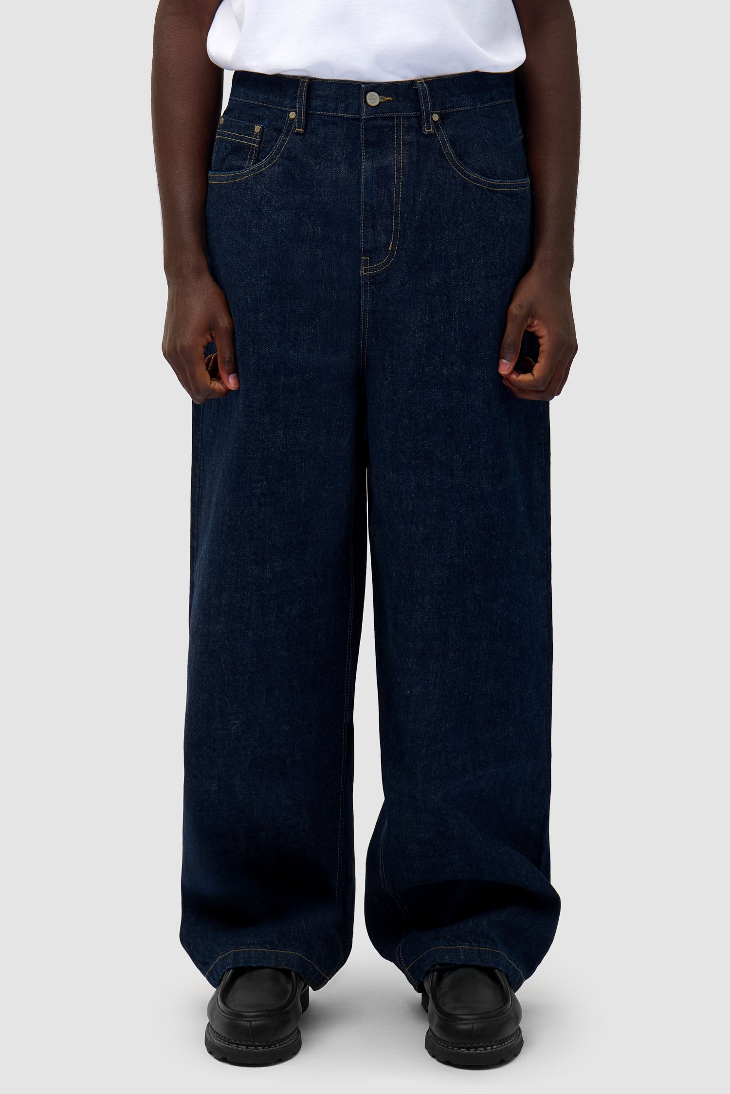 Denim Pants in Dark Wash worn by a model, half-body front view