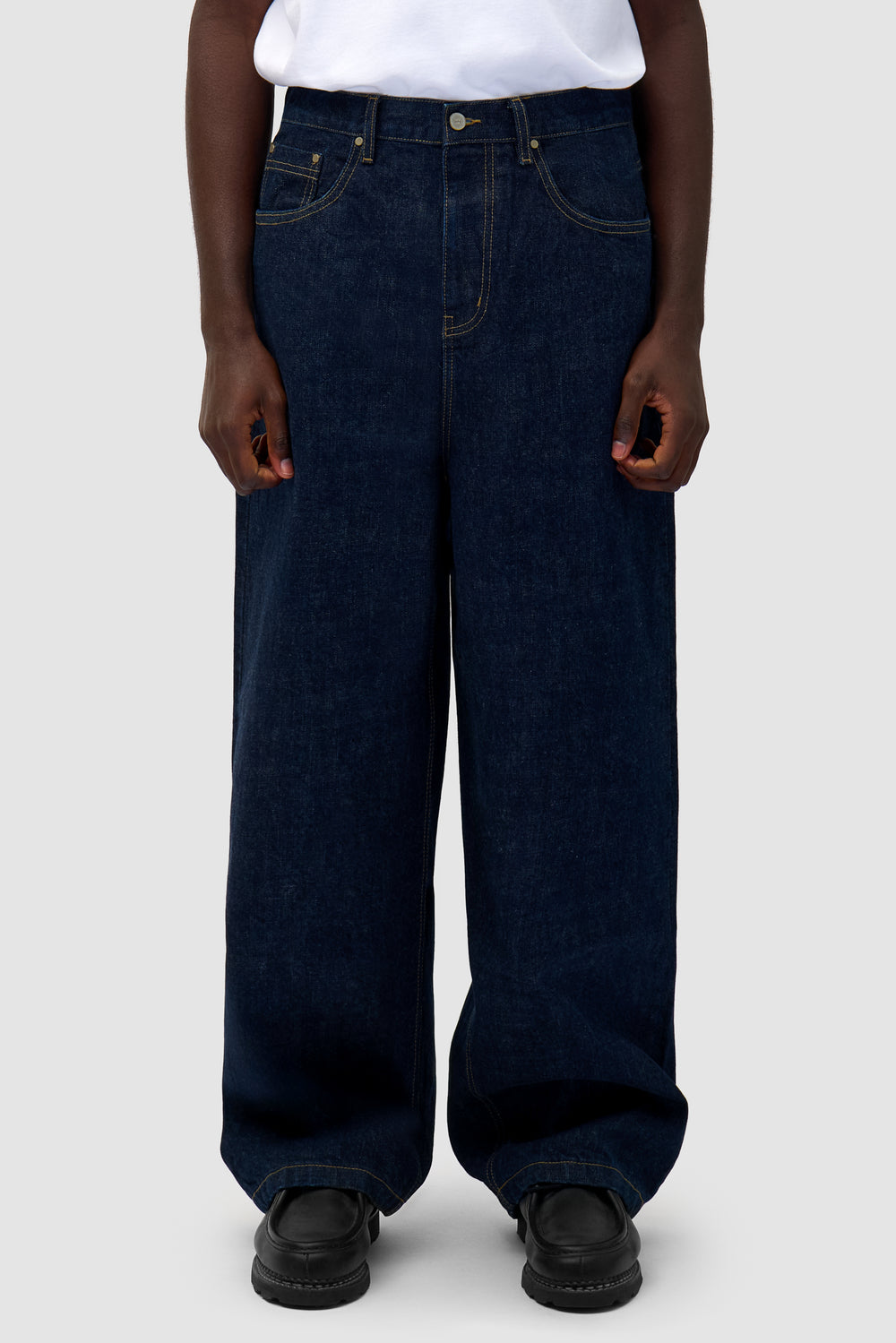 Denim Pants in Dark Wash worn by a model, half-body front view