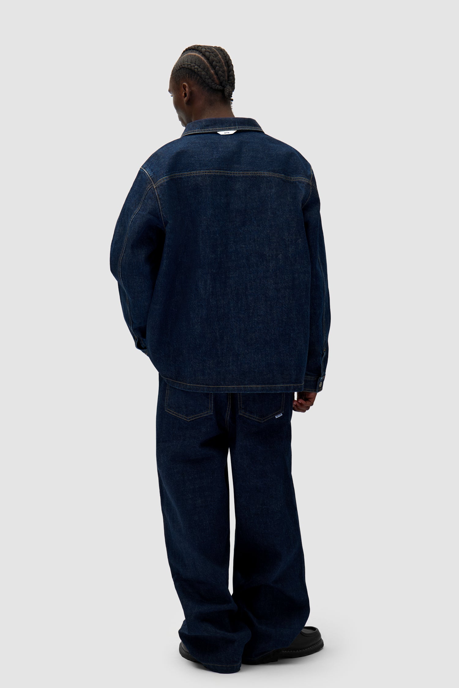 Denim Pants in Dark Wash worn by a model, full-body side view