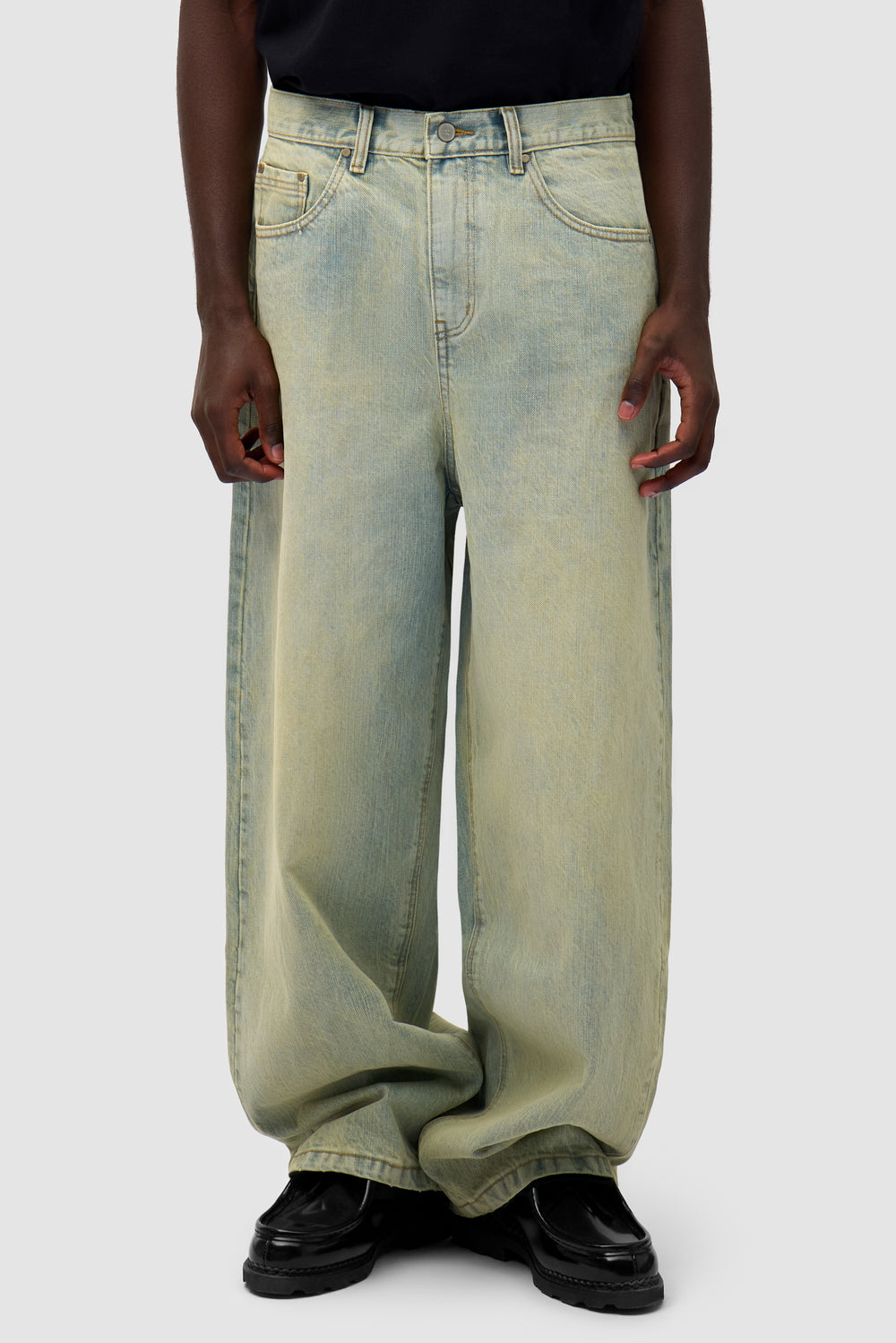 Denim Pants in Dirty Wash worn by a model, half-body front view