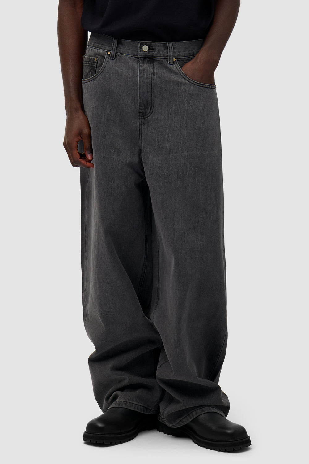 Denim Pants in Fade Black worn by a model, half-body front view