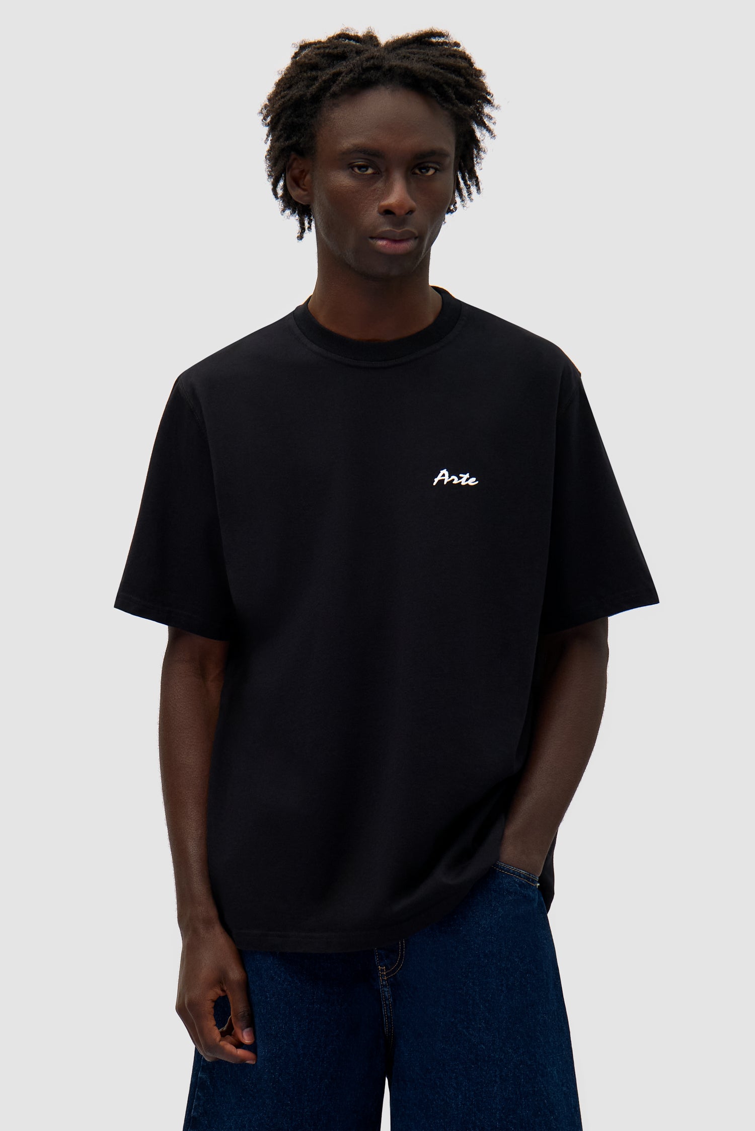 Elements Print T-shirt in Black worn by a model, half-body front view