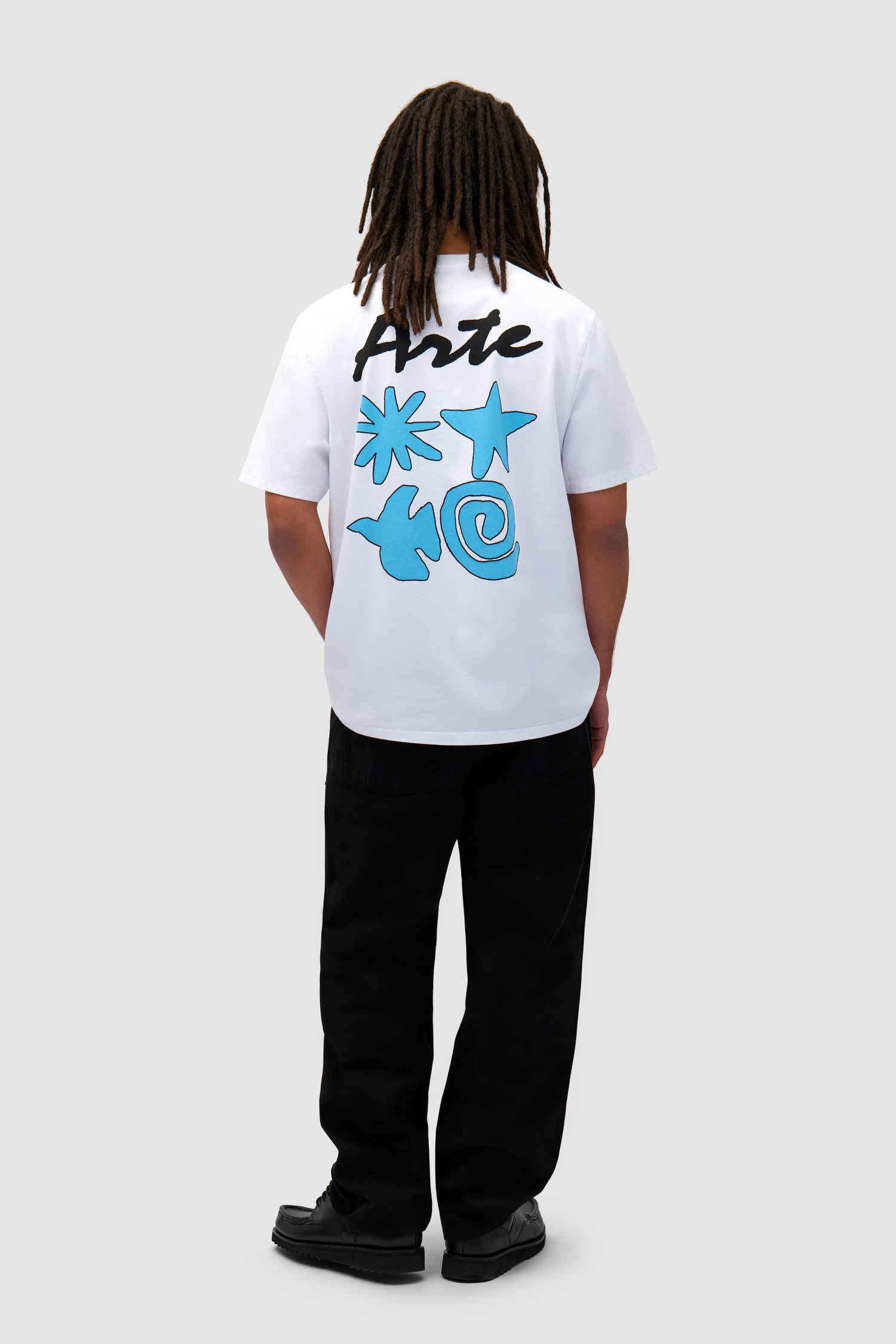 Elements Print T-shirt in White worn by a model, full-body front view