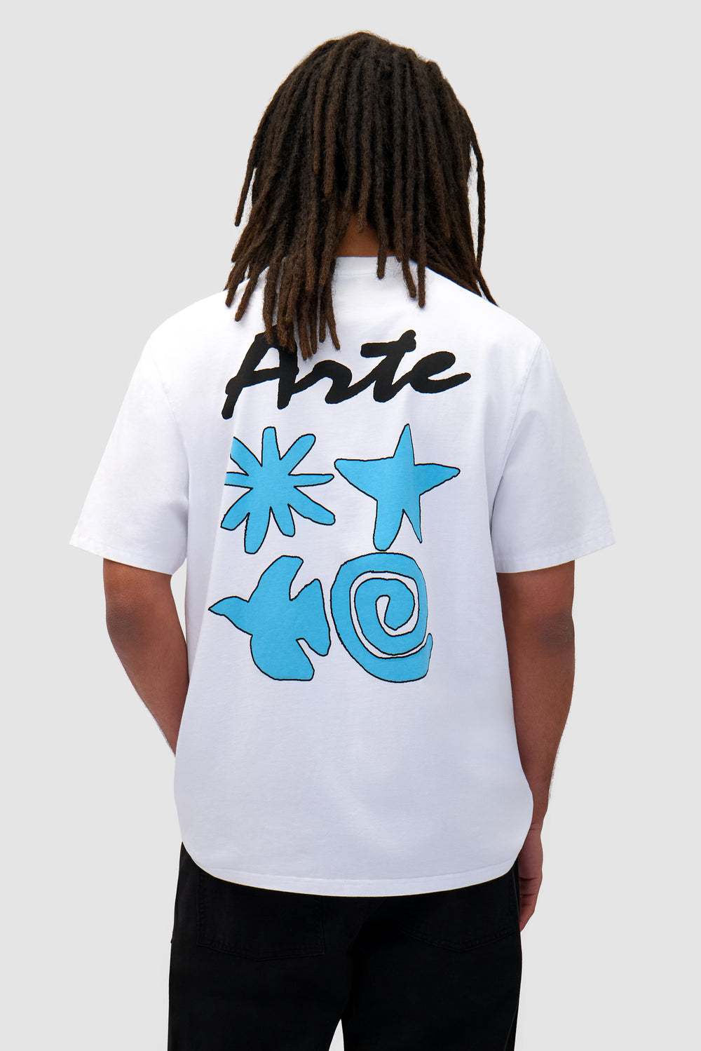 Elements Print T-shirt in White worn by a model, half-body back view