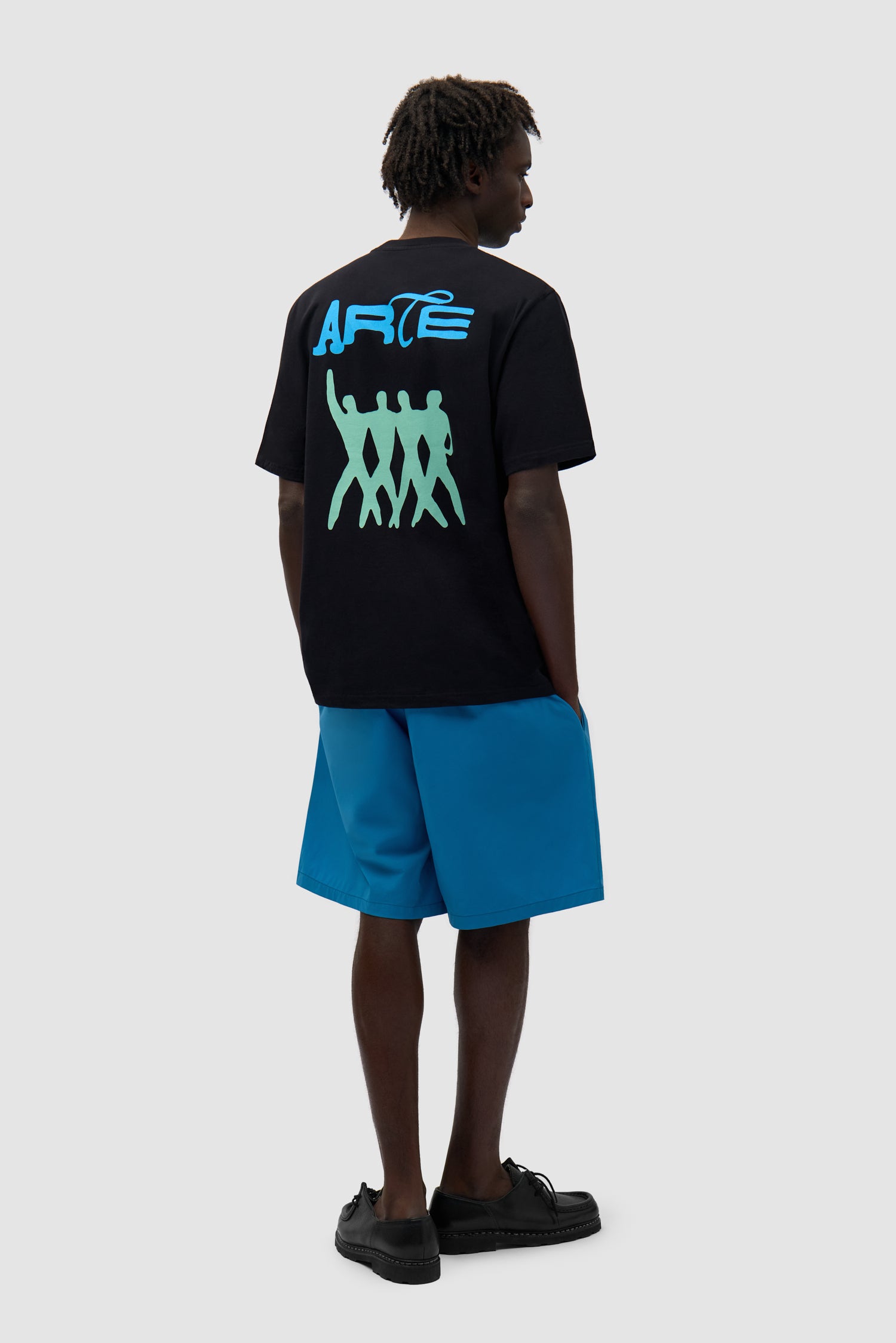 Back Logo People T-shirt in Black worn by a model, full-body front view