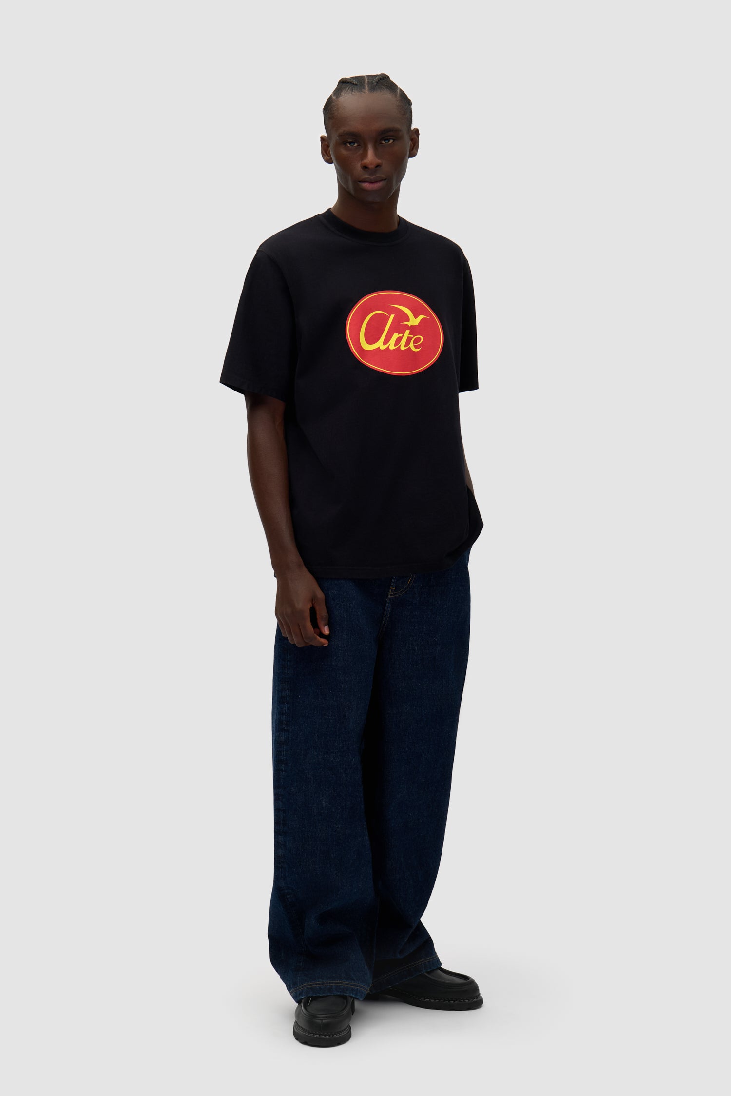 Big Bird Logo T-shirt in Black worn by a model, full-body front view