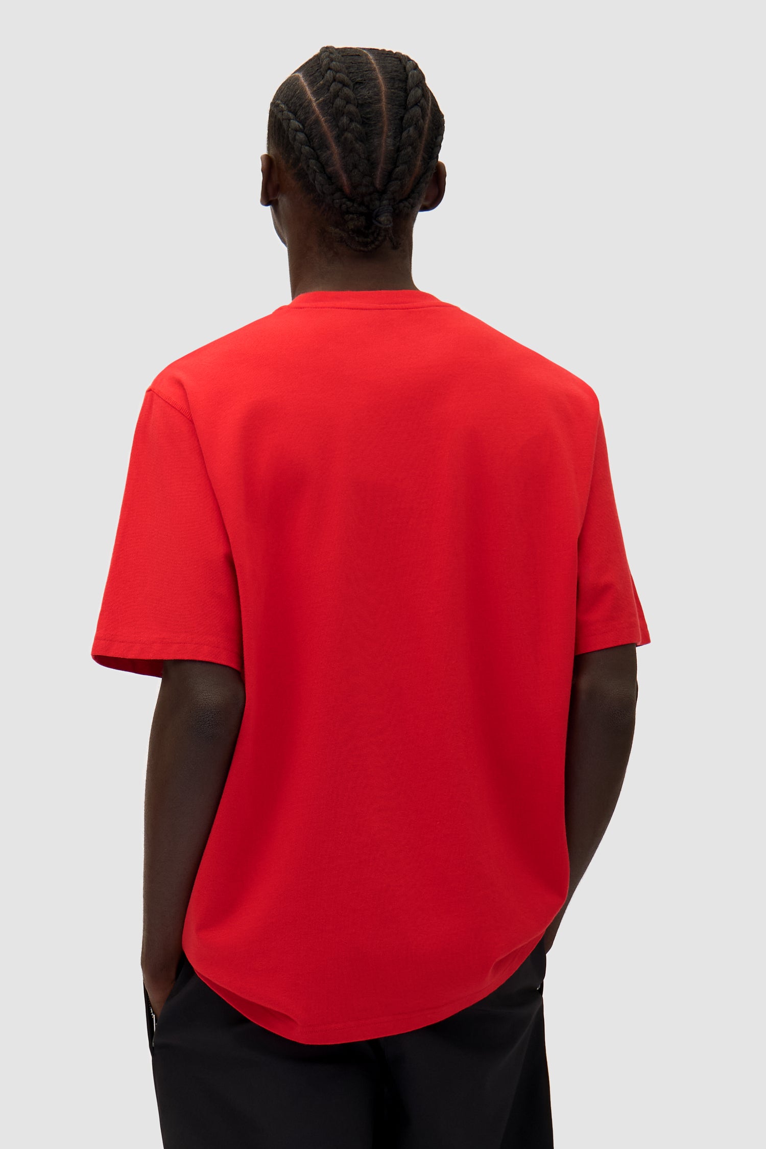 Big Bird Logo T-shirt in Red worn by a model, half-body back view