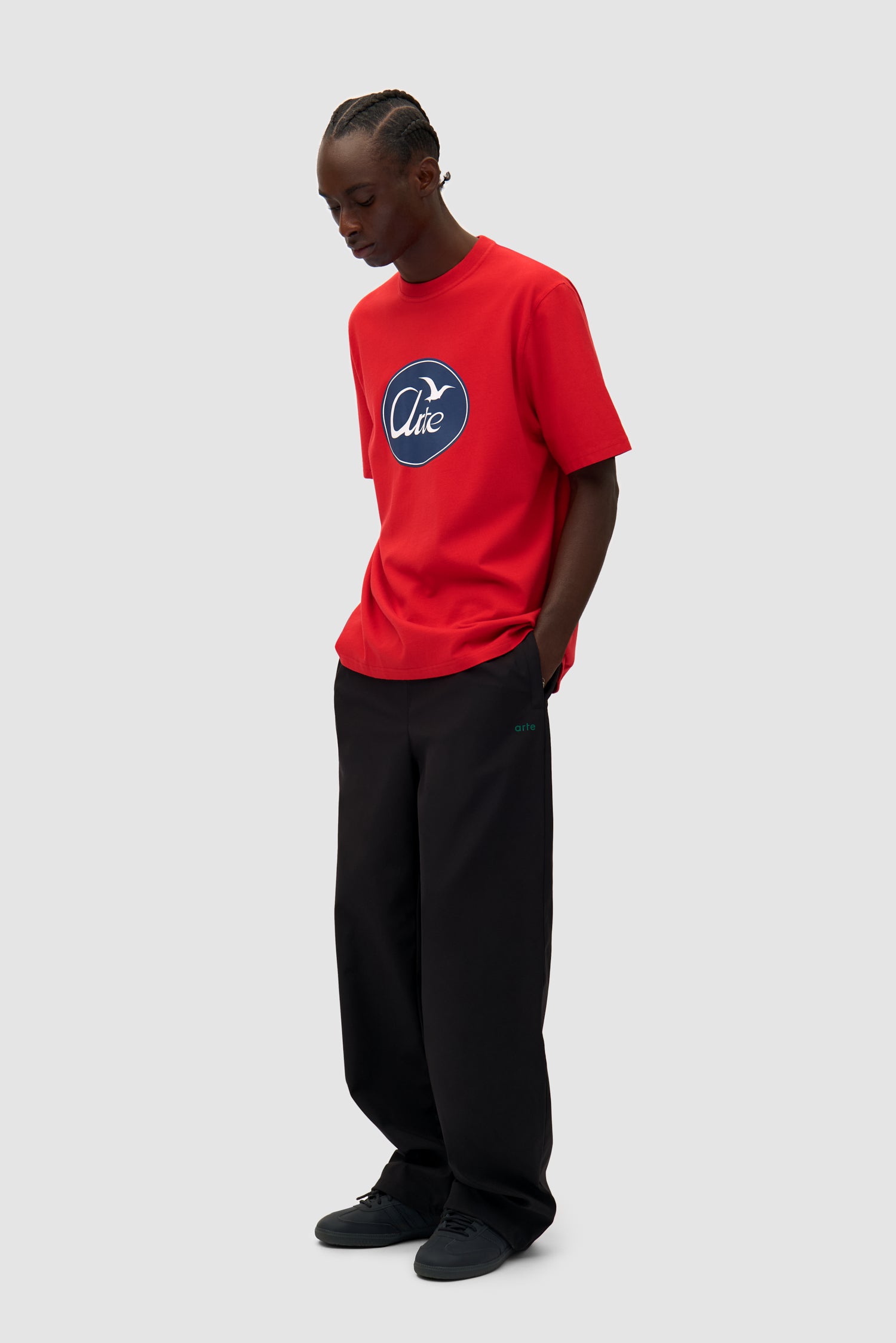Big Bird Logo T-shirt in Red worn by a model, full-body side view