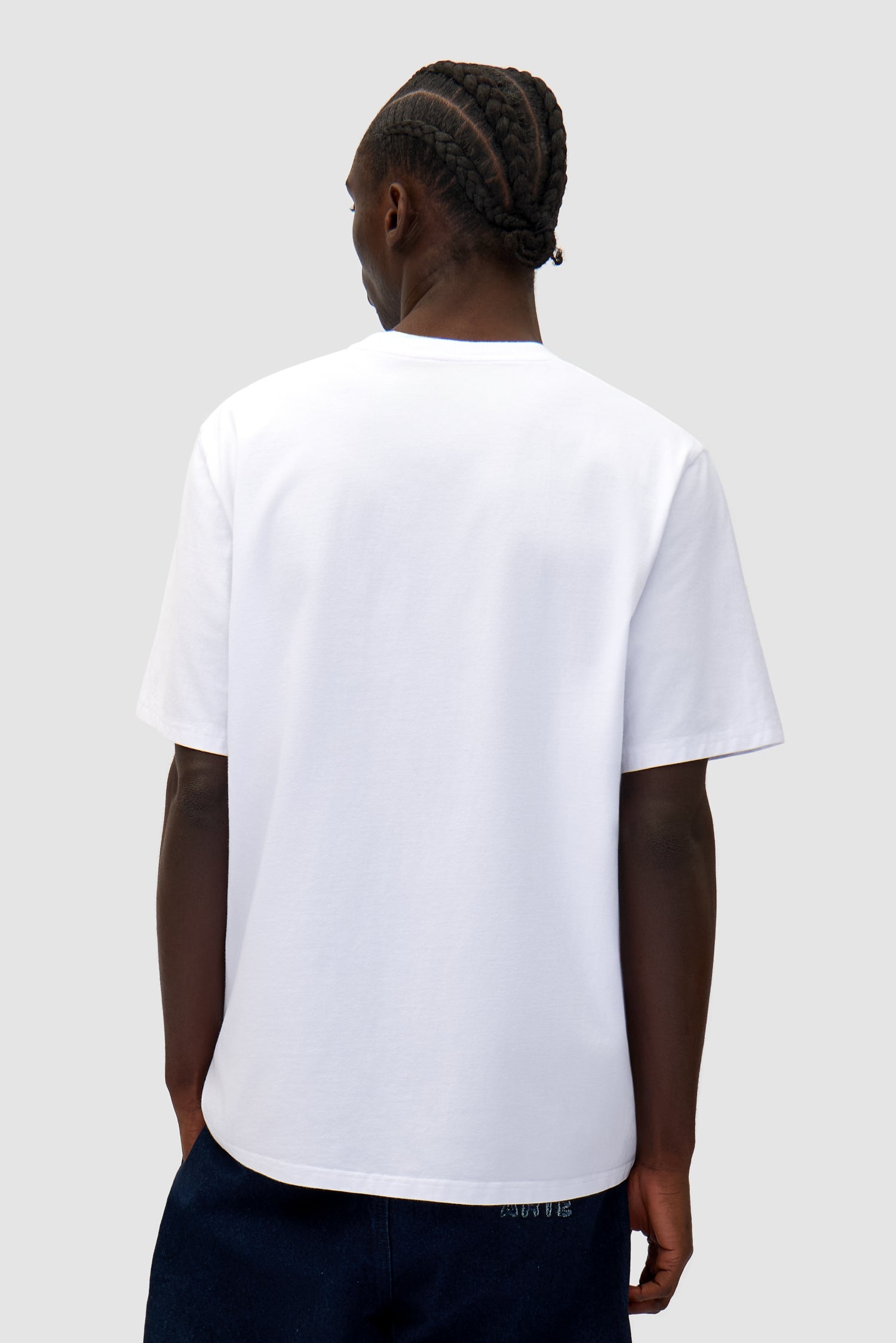Big Bird Logo T-shirt in White worn by a model, half-body back view