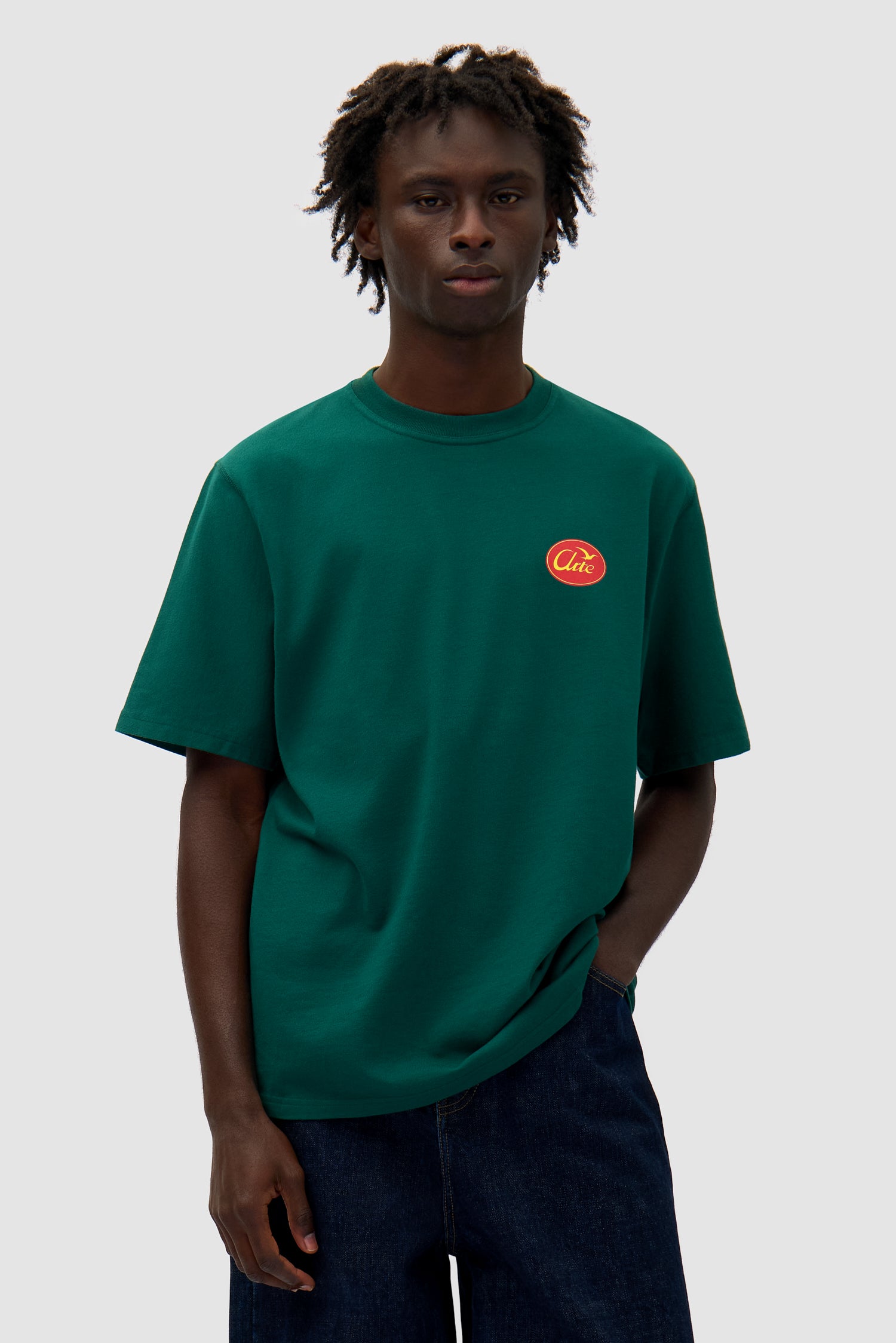 Small Bird T-shirt in Green worn by a model, half-body front view