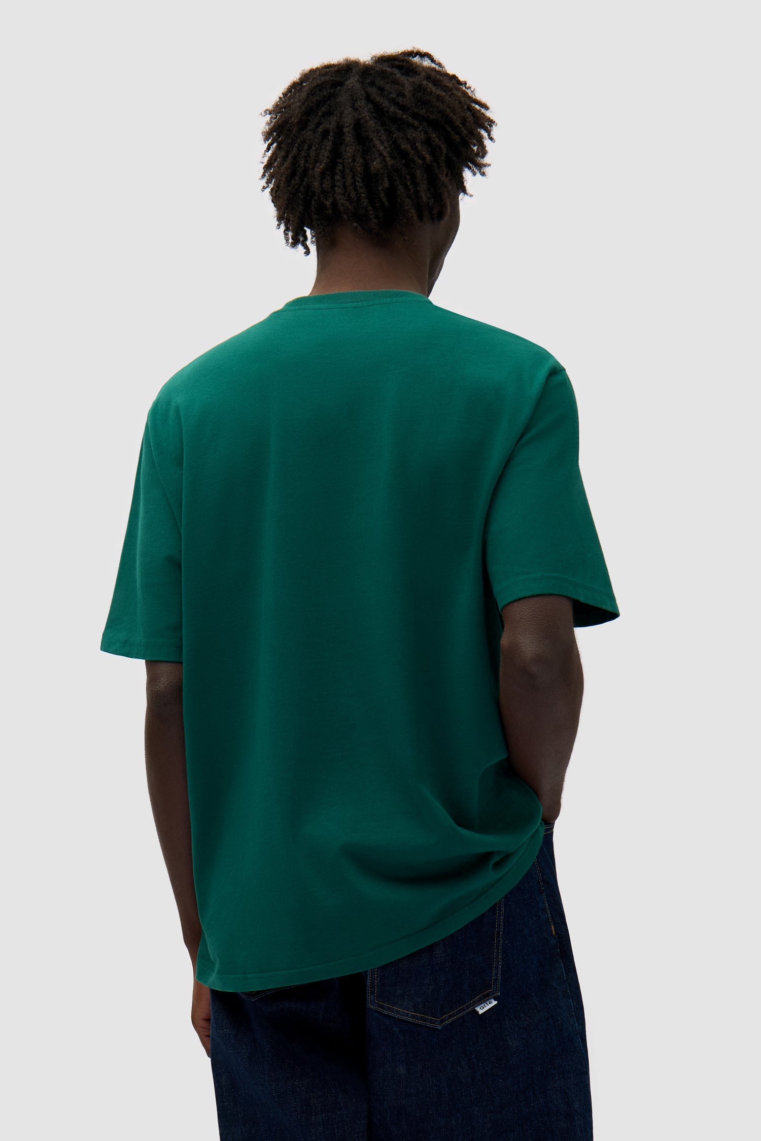 Small Bird T-shirt in Green worn by a model, half-body back view