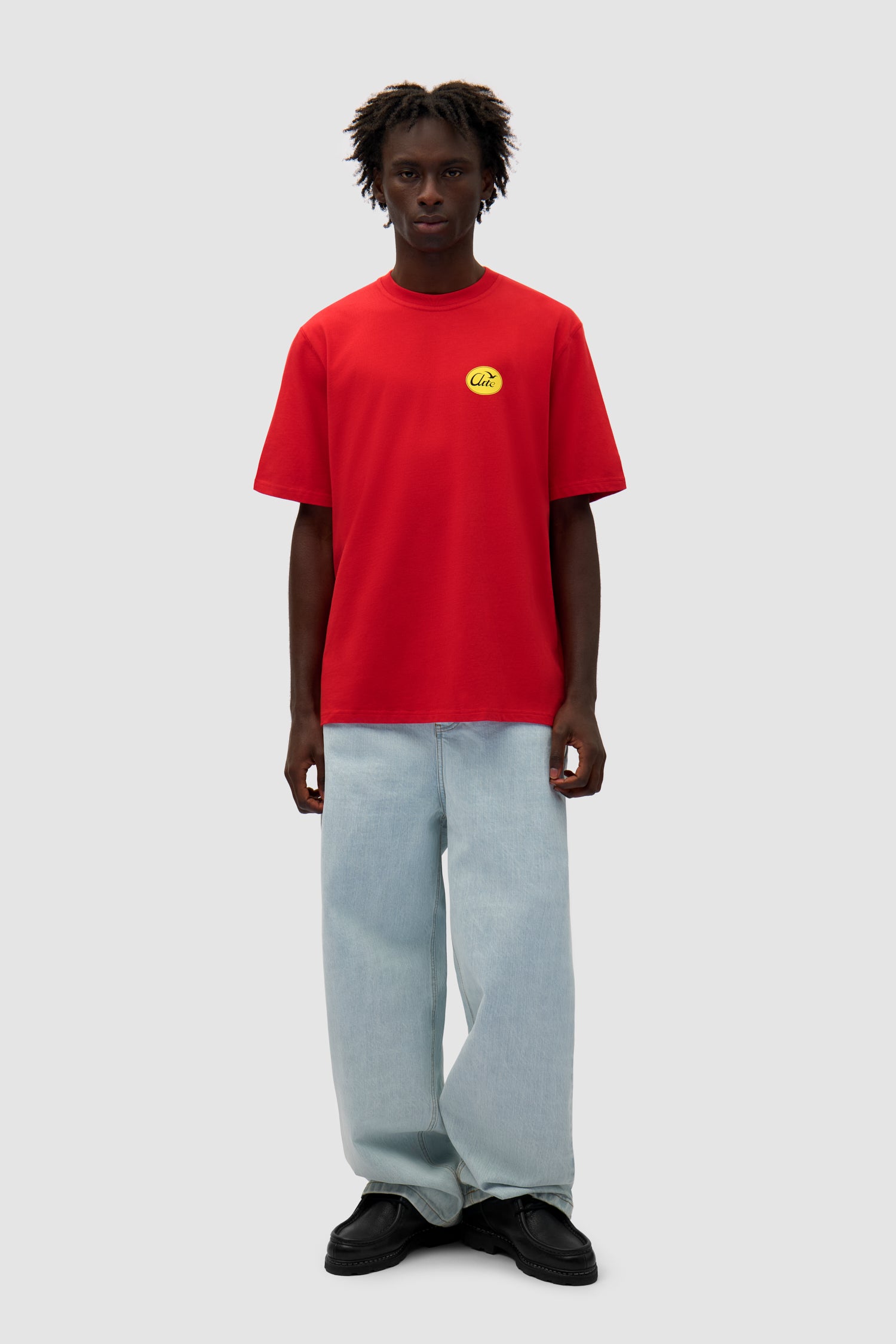 Small Bird T-shirt in Red worn by a model, full-body front view