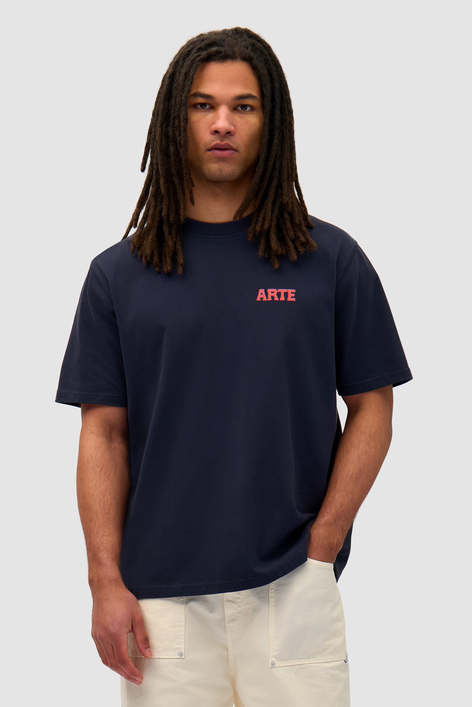 Mural Back Print T-shirt in Navy worn by a model, half-body front view