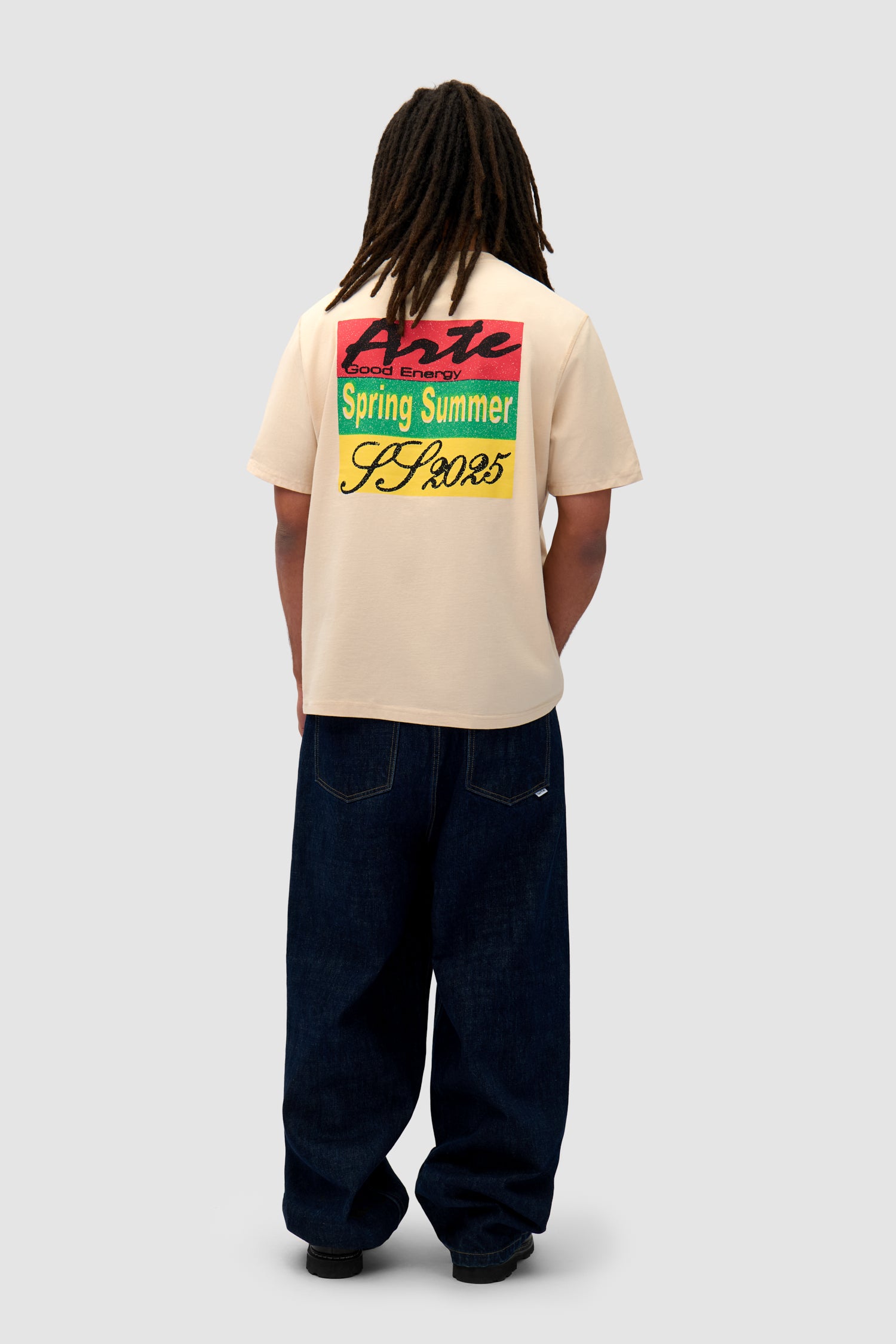 Multicolor Print T-shirt in Cream worn by a model, full-body back view