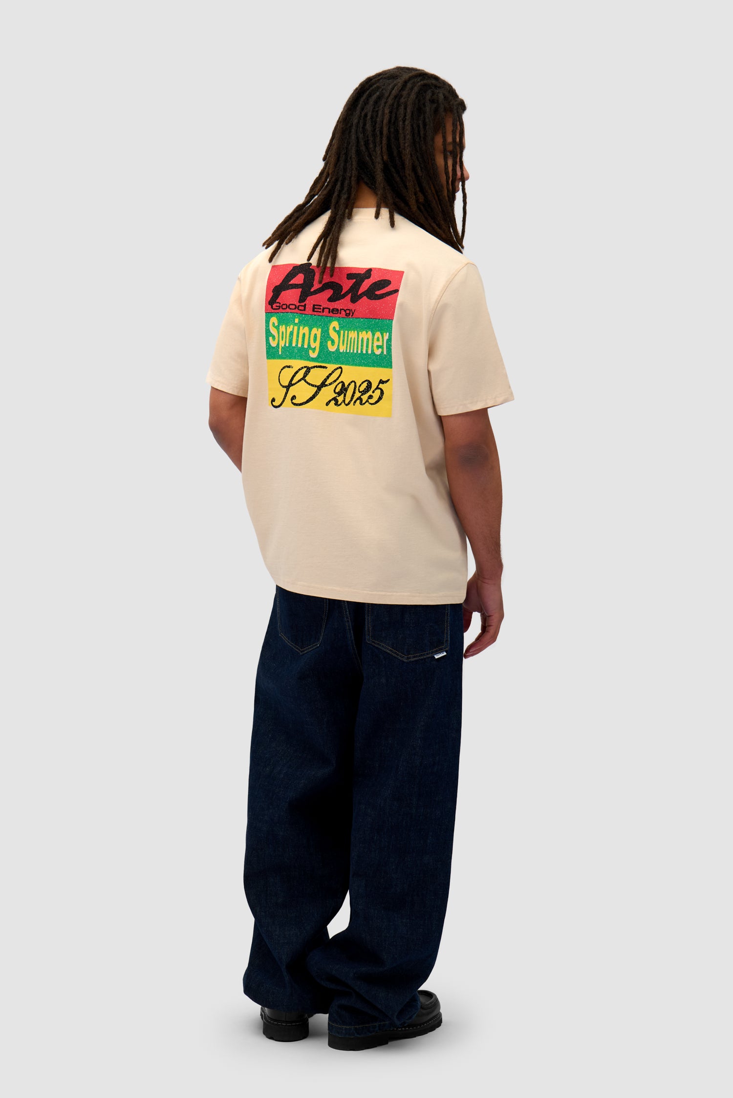 Multicolor Print T-shirt in Cream worn by a model, full-body side view