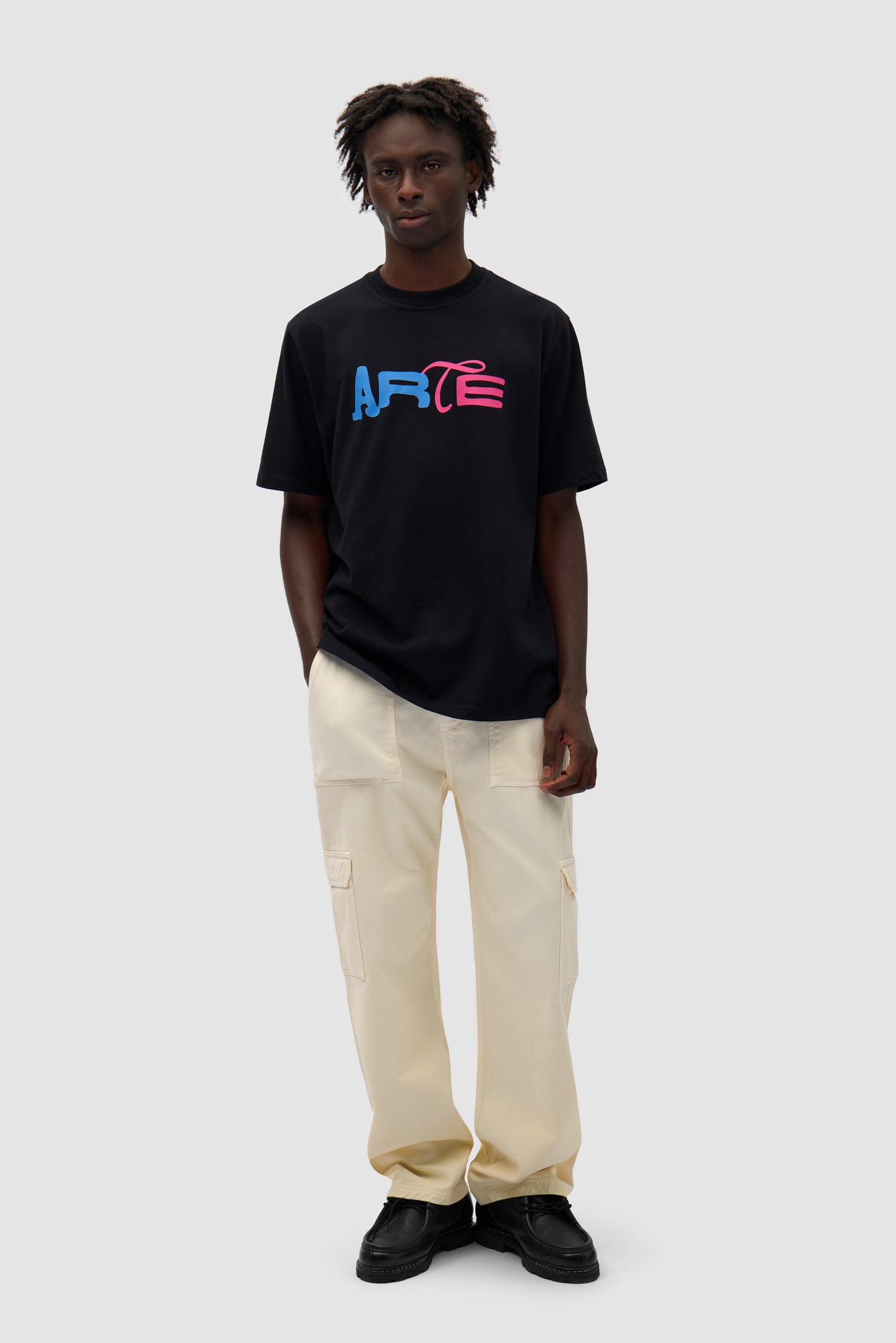 Duo Print Logo T-shirt in Black worn by a model, full-body front view