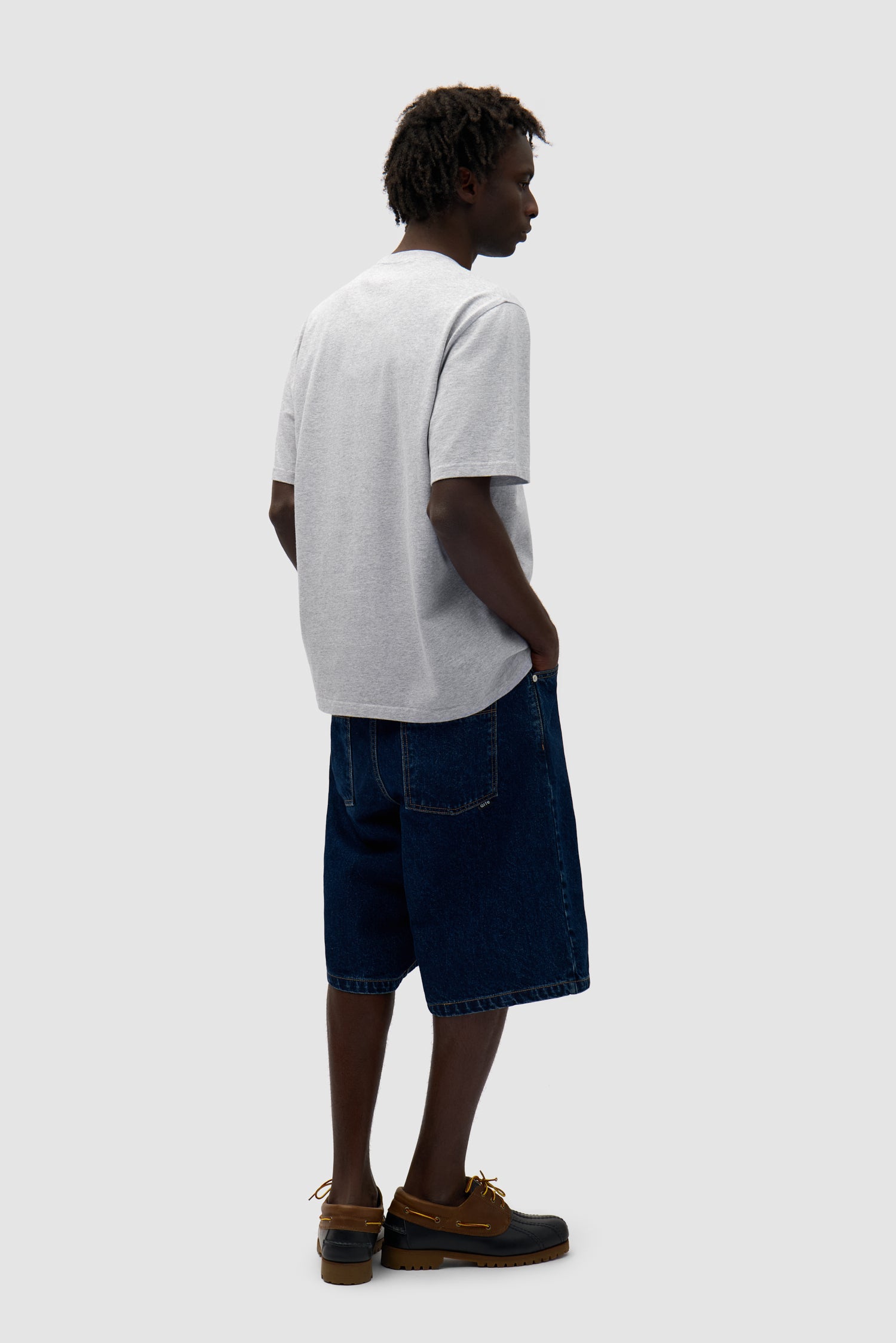 Duo Print Logo T-shirt in Grey worn by a model, full-body back view