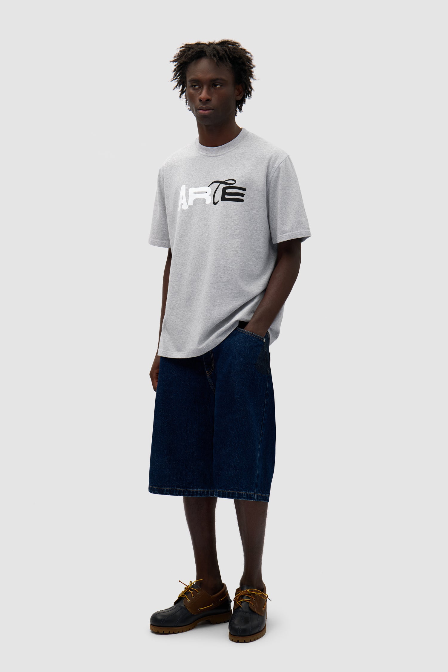 Duo Print Logo T-shirt in Grey worn by a model, full-body side view