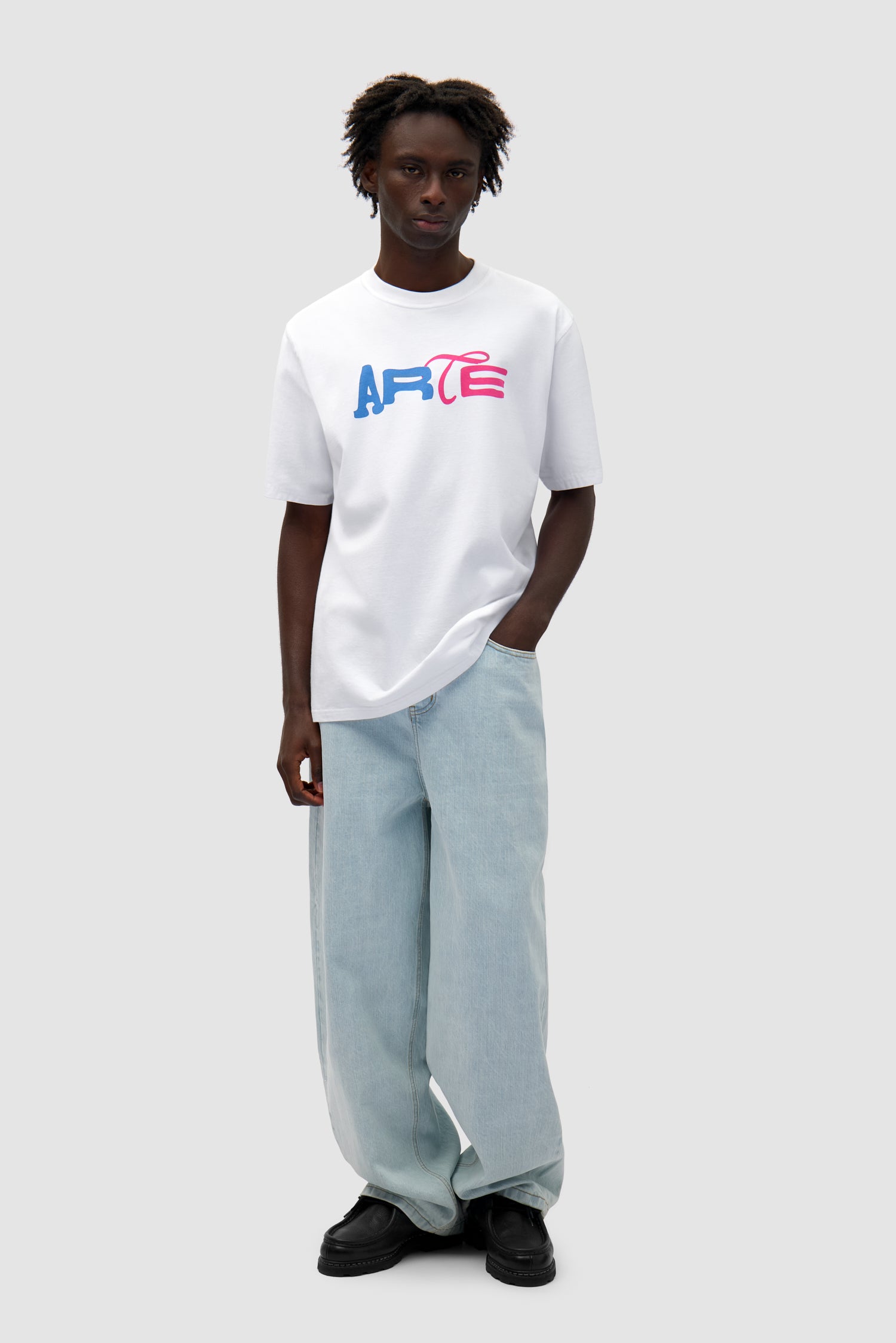 Duo Print Logo T-shirt in White worn by a model, full-body front view