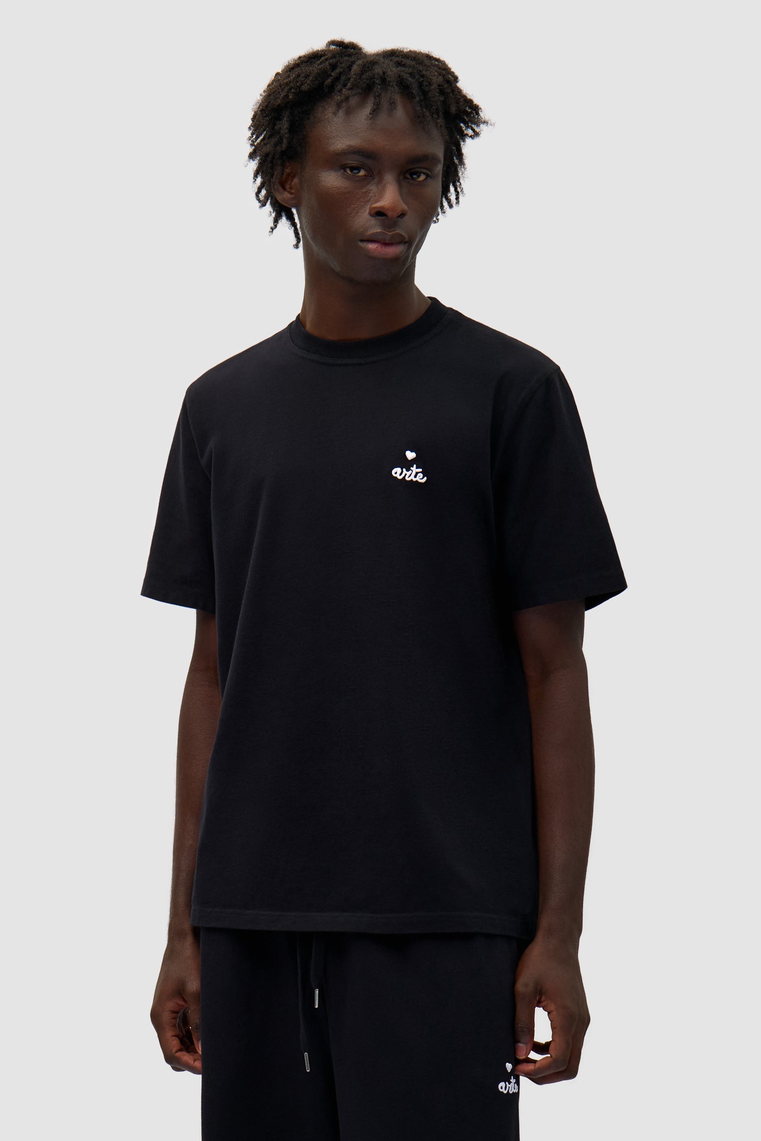 Heart Logo T-shirt in Black worn by a model, half-body front view