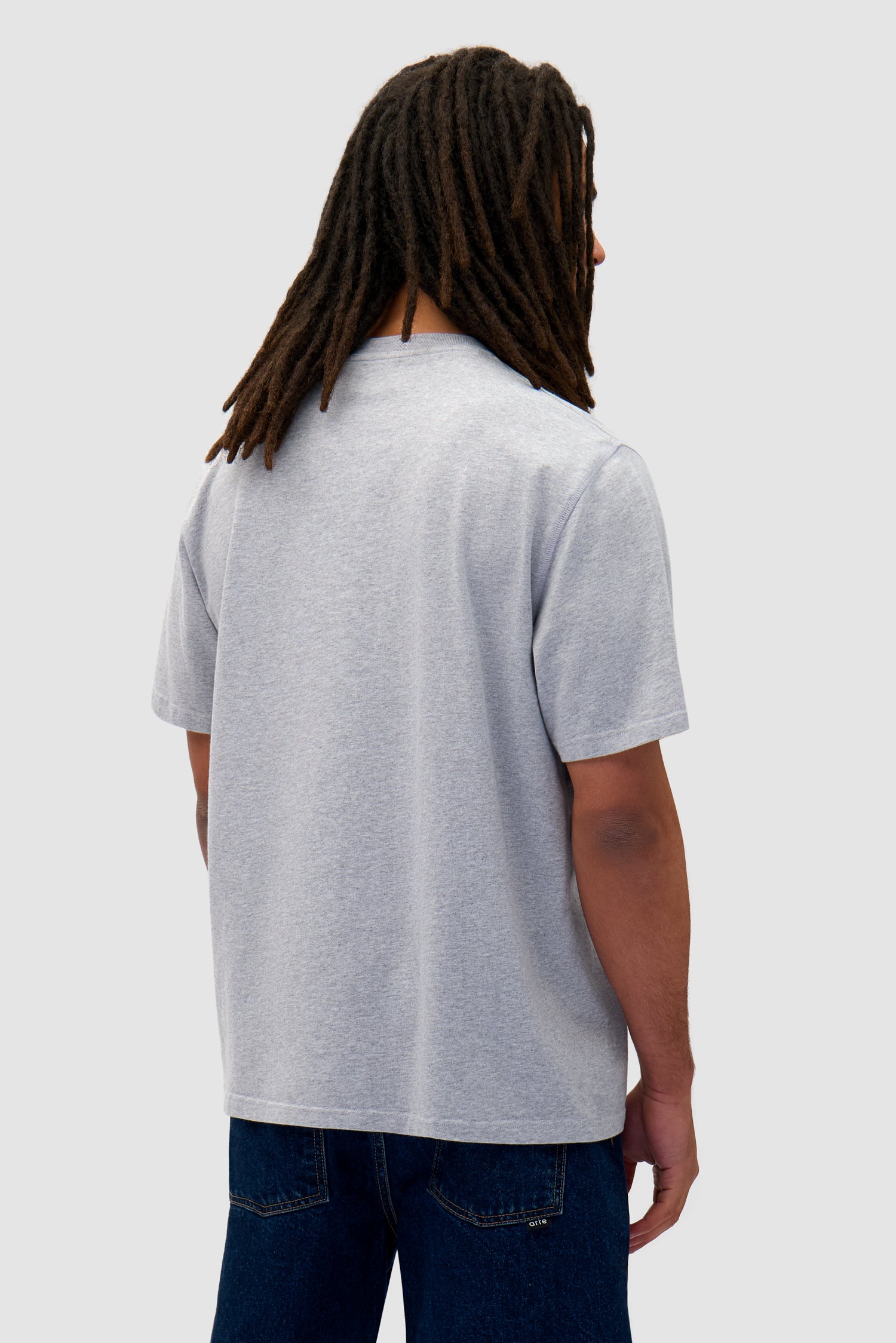 Heart Logo T-shirt in Grey worn by a model, half-body back view