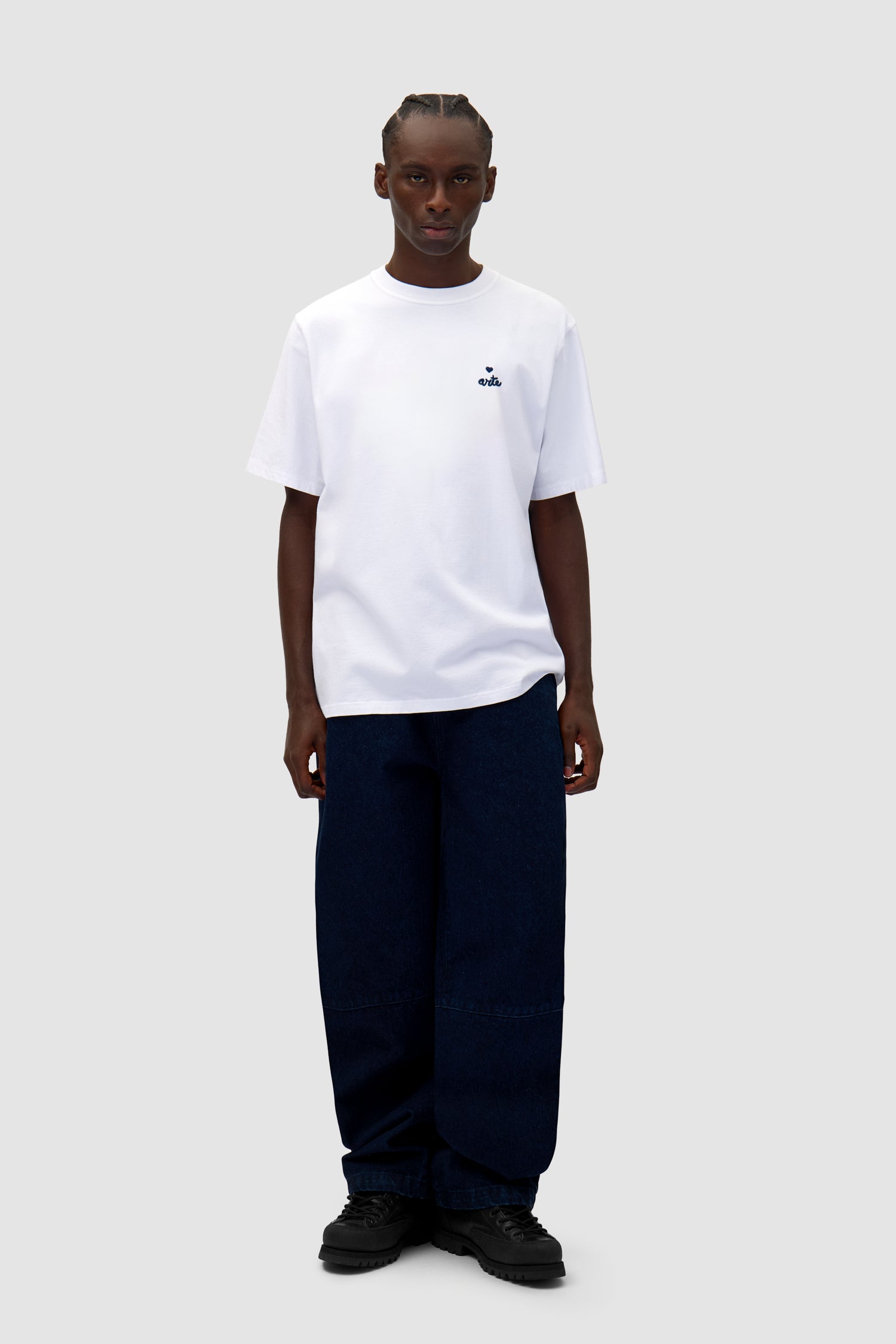 Heart Logo T-shirt in White worn by a model, full-body front view