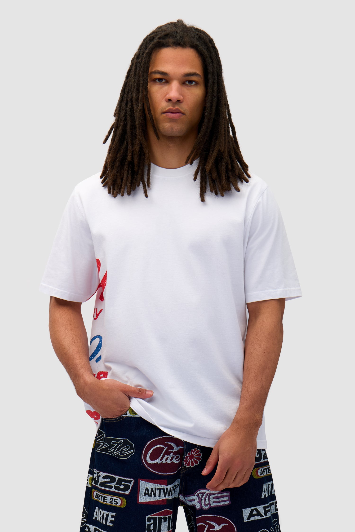 Side Print T-shirt in White worn by a model, half-body front view