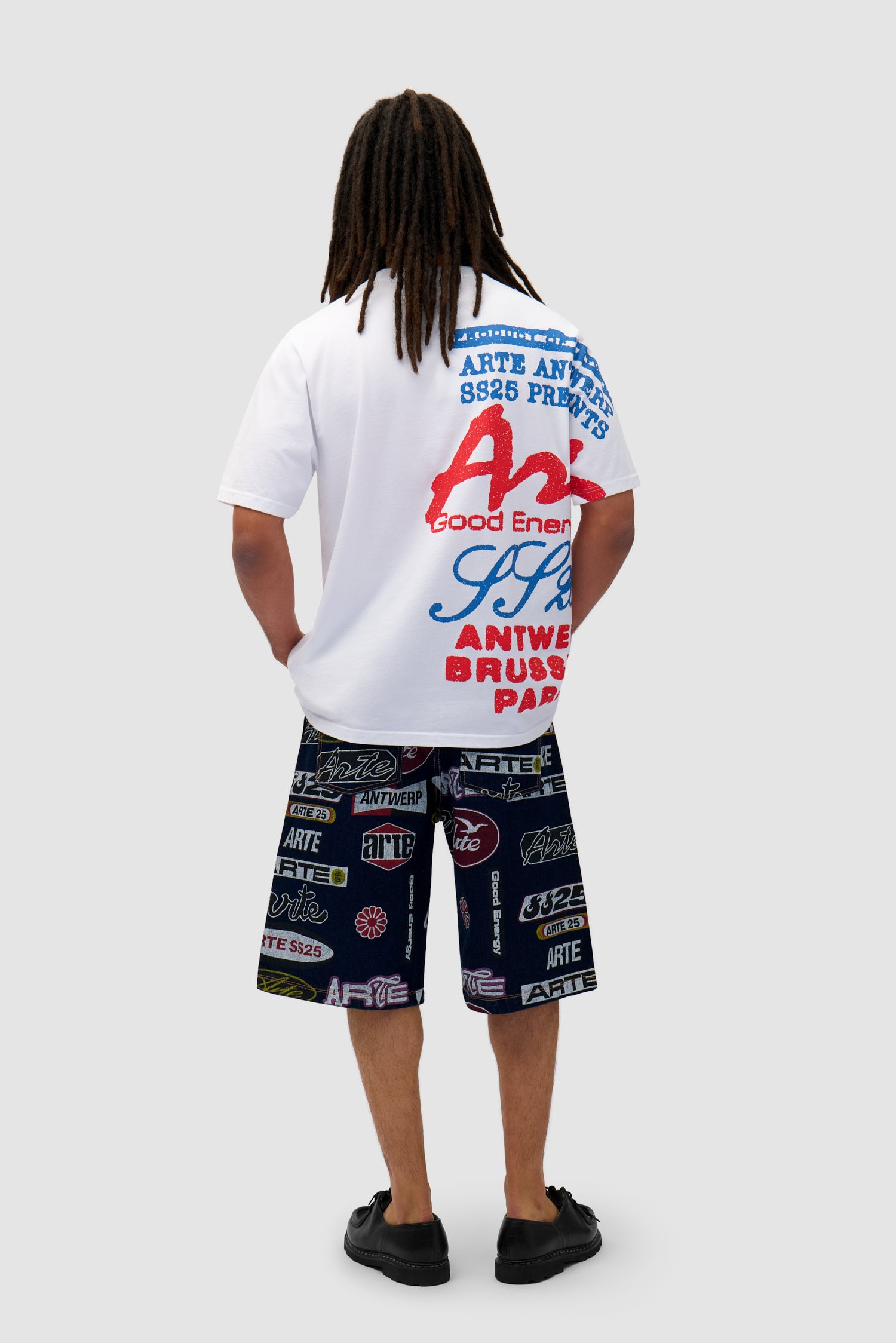 Side Print T-shirt in White worn by a model, full-body back view