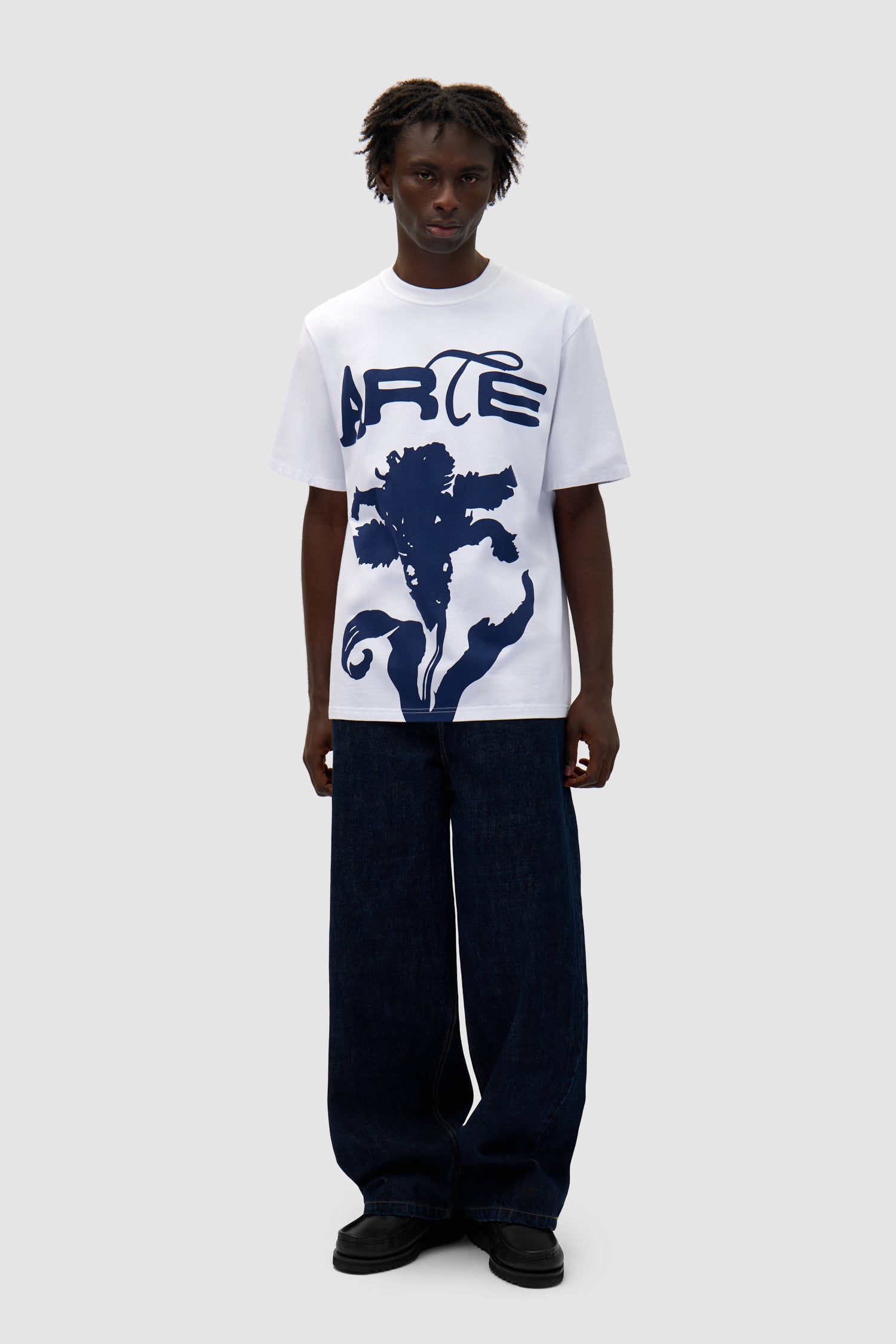 Big Flower T-shirt in White worn by a model, full-body front view