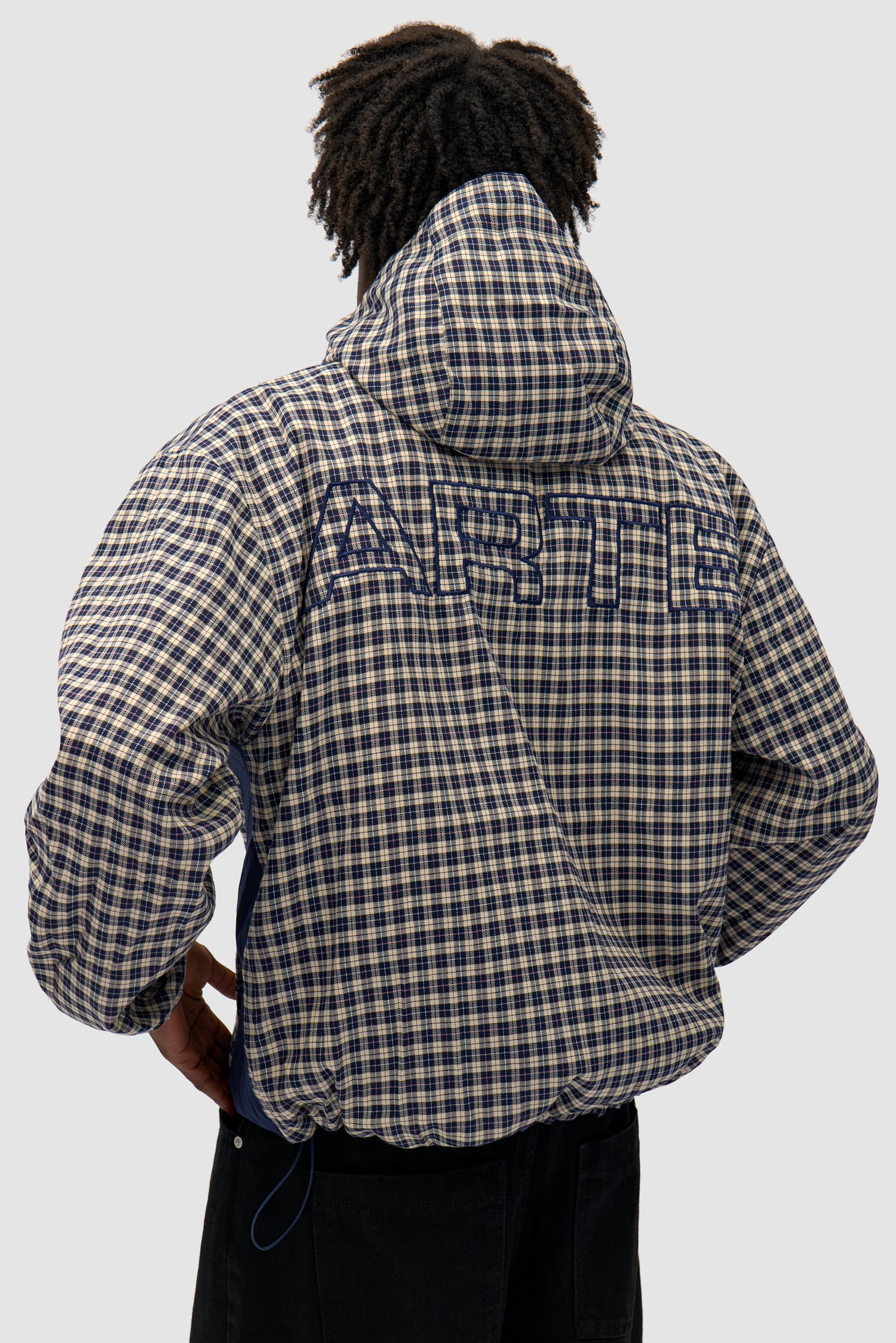 Reversible Plaid Technical Jacket in Navy/Plaid worn by a model, full-body back view, logo detail
