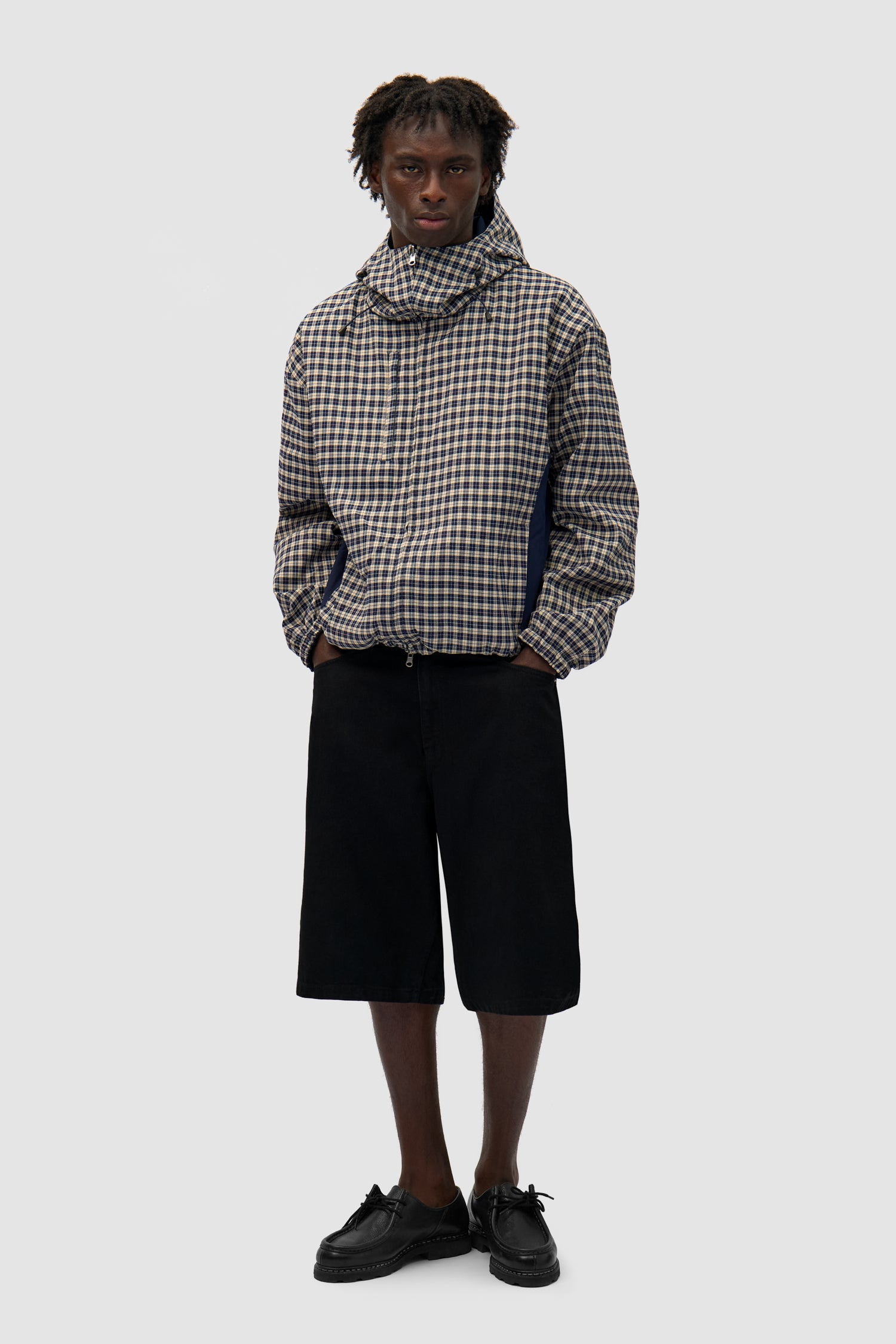 Reversible Plaid Technical Jacket in Navy/Plaid worn by a model, full-body front view, plaid side