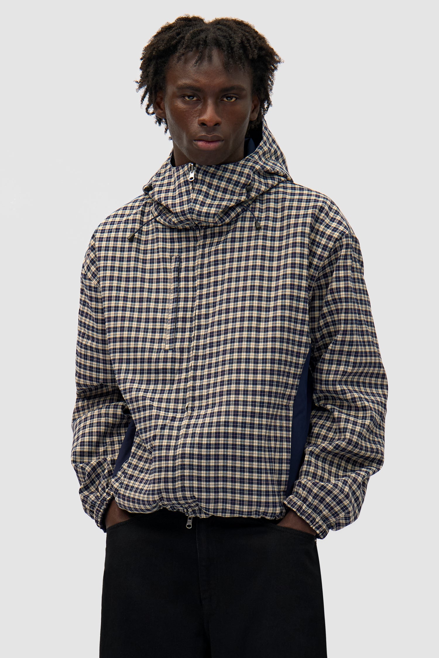 Reversible Plaid Technical Jacket in Navy/Plaid worn by a model, half-body front view, plaid side