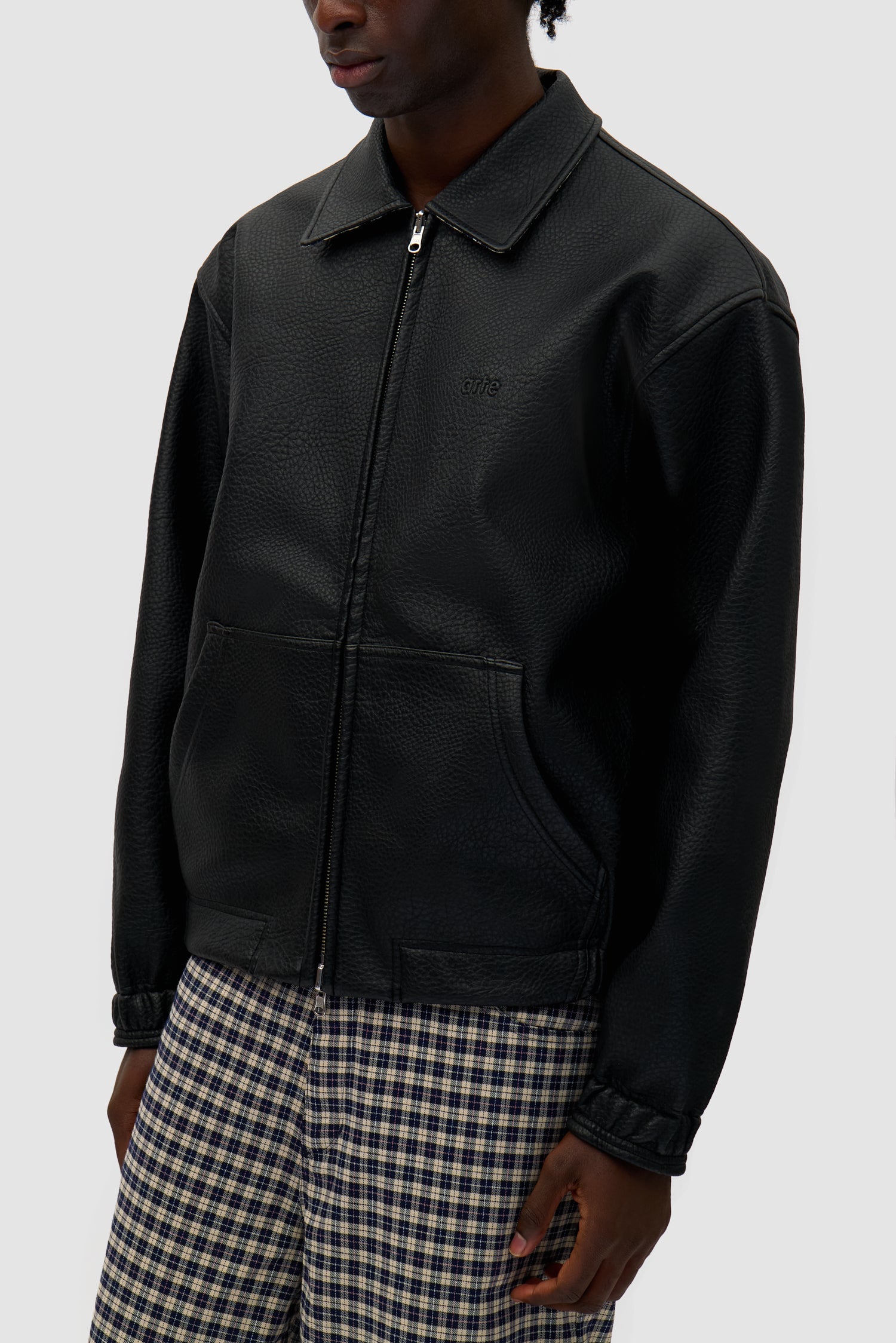 Detail view of Reversible Plaid Leather Jacket in Black/Plaid