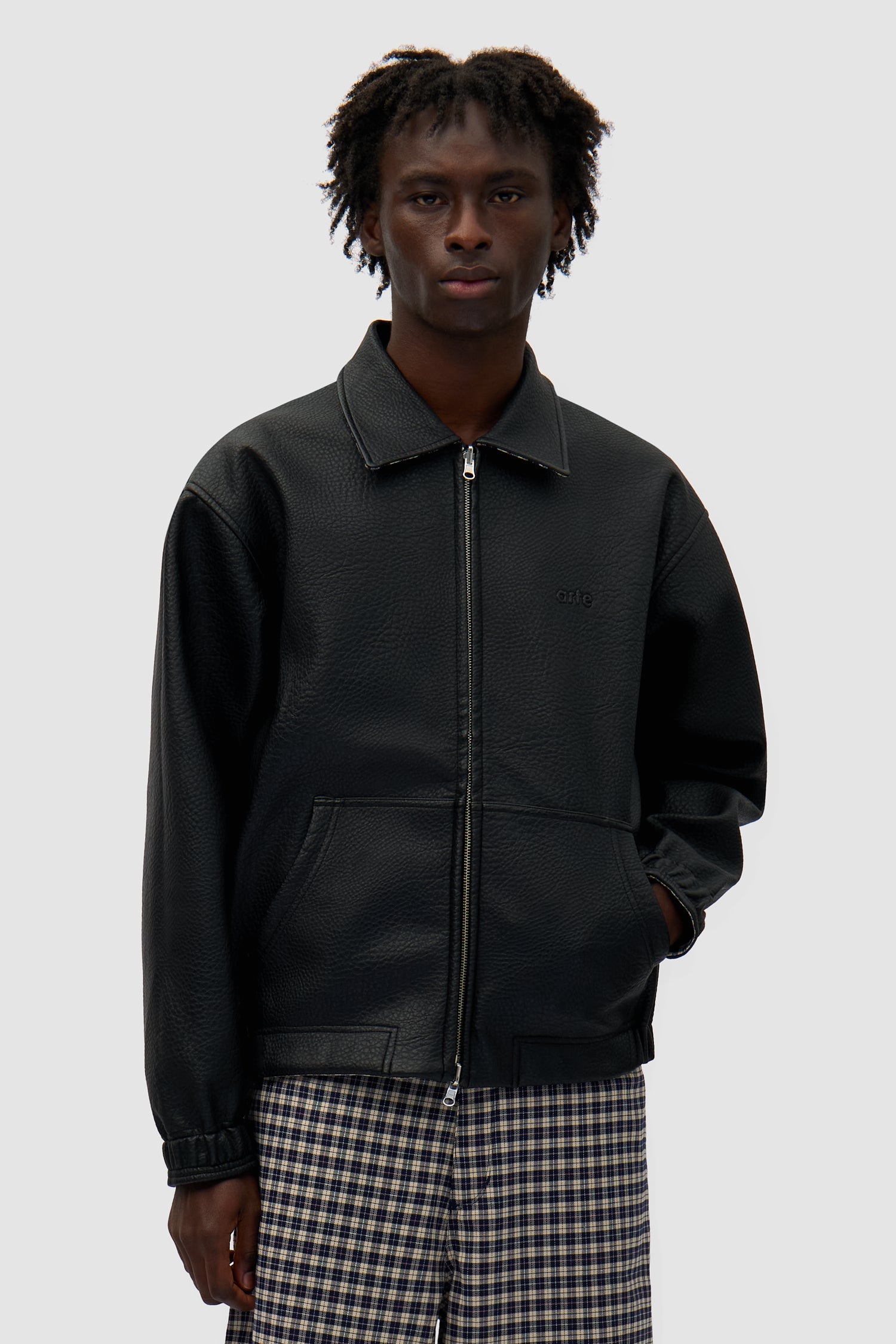 Reversible Plaid Leather Jacket in Black/Plaid worn by a model, half-body front view