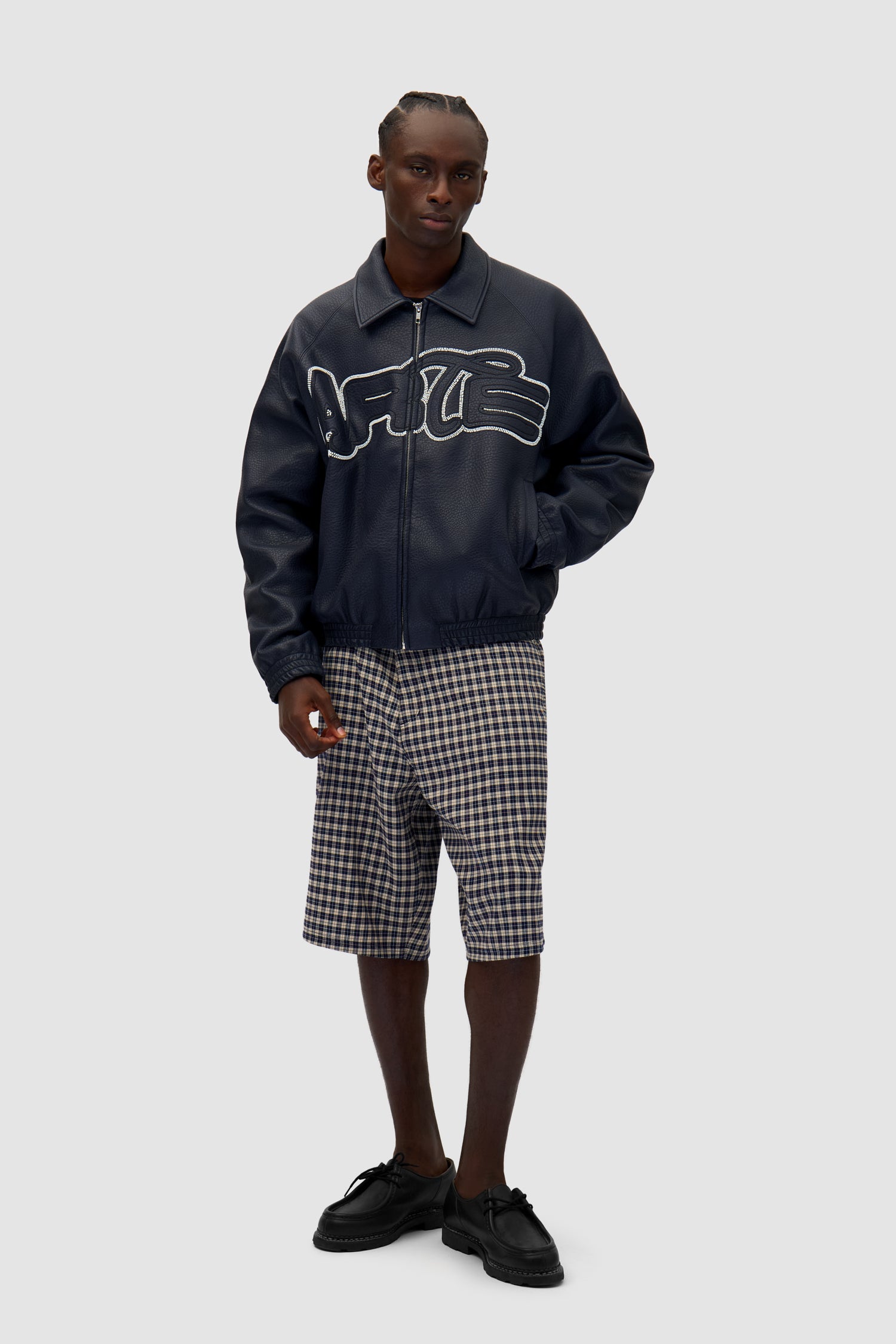 Big Logo Leather Jacket in Navy worn by a model, full-body front view