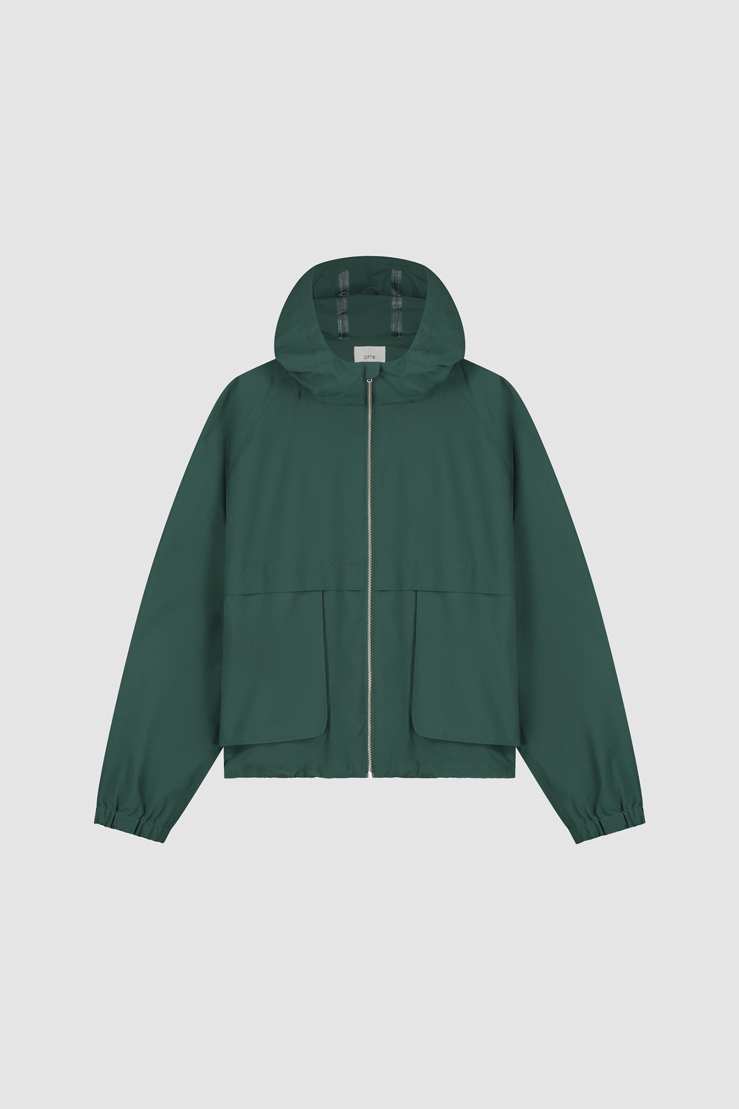 Bird Logo Anorak in Green worn by a model, half-body detailed view