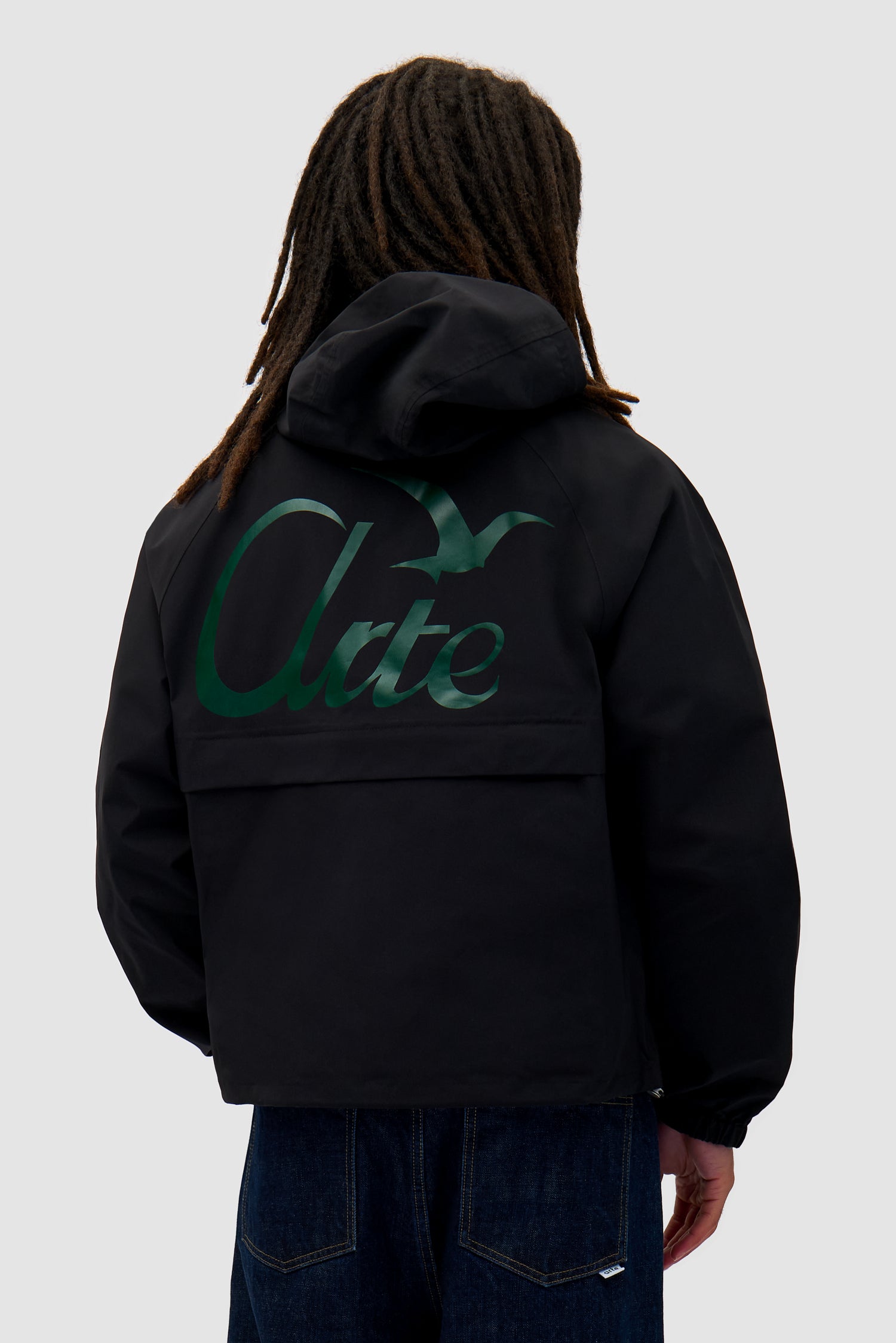 Bird Logo Anorak in Black worn by a model, half-body front view