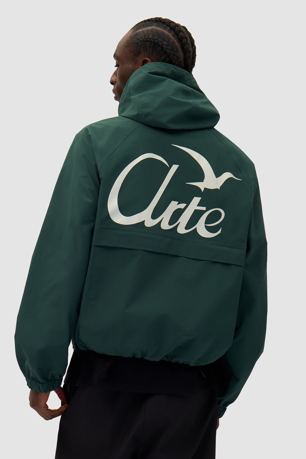 Bird Logo Anorak in Green worn by a model, half-body front view