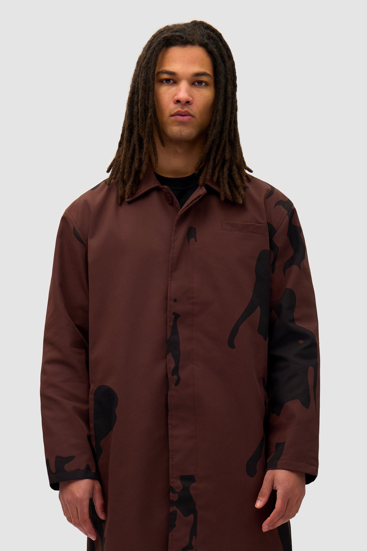 Printed People Brown Coat in Brown/Black worn by a model, half-body front view