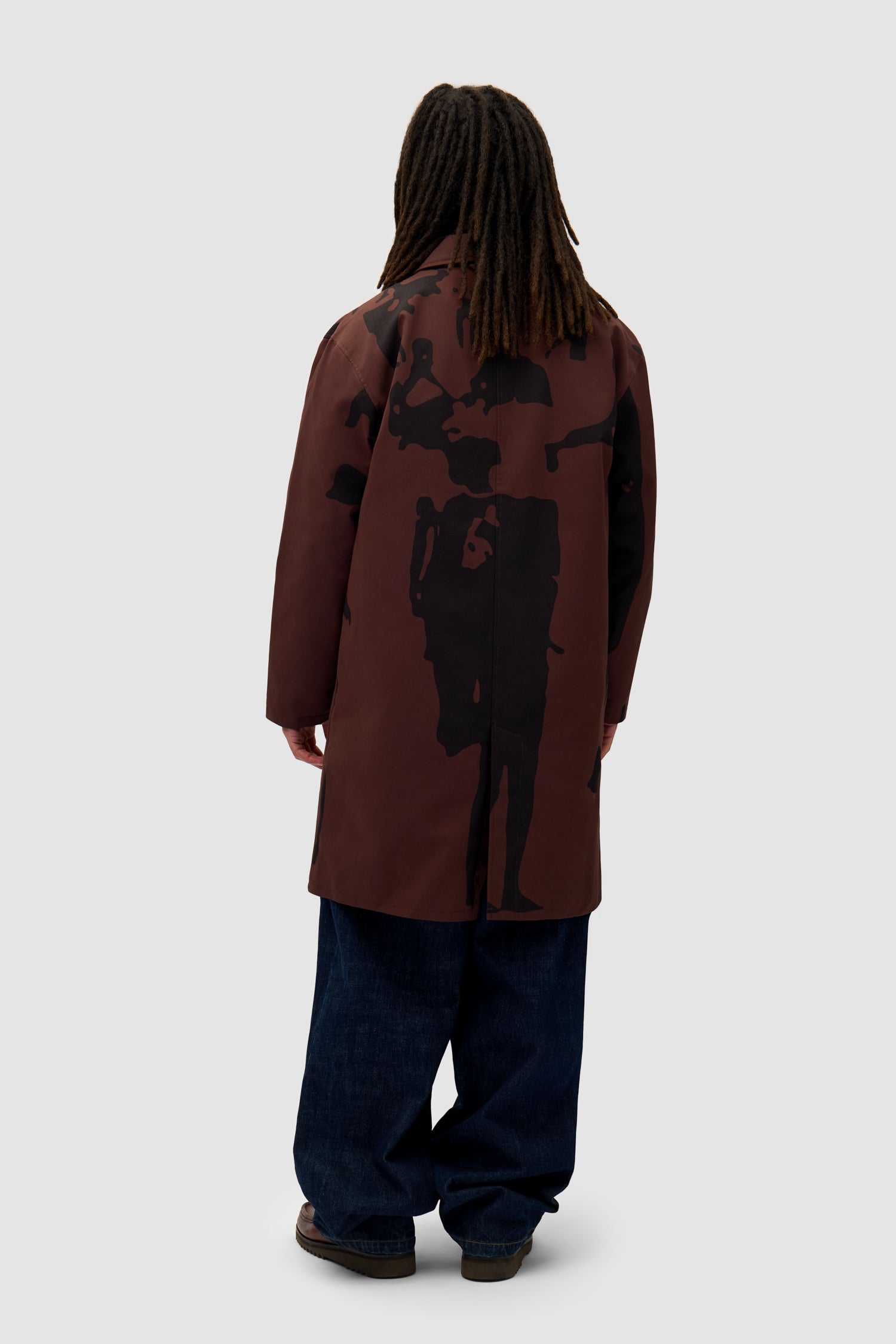 Printed People Brown Coat in Brown/Black worn by a model, full-body side view