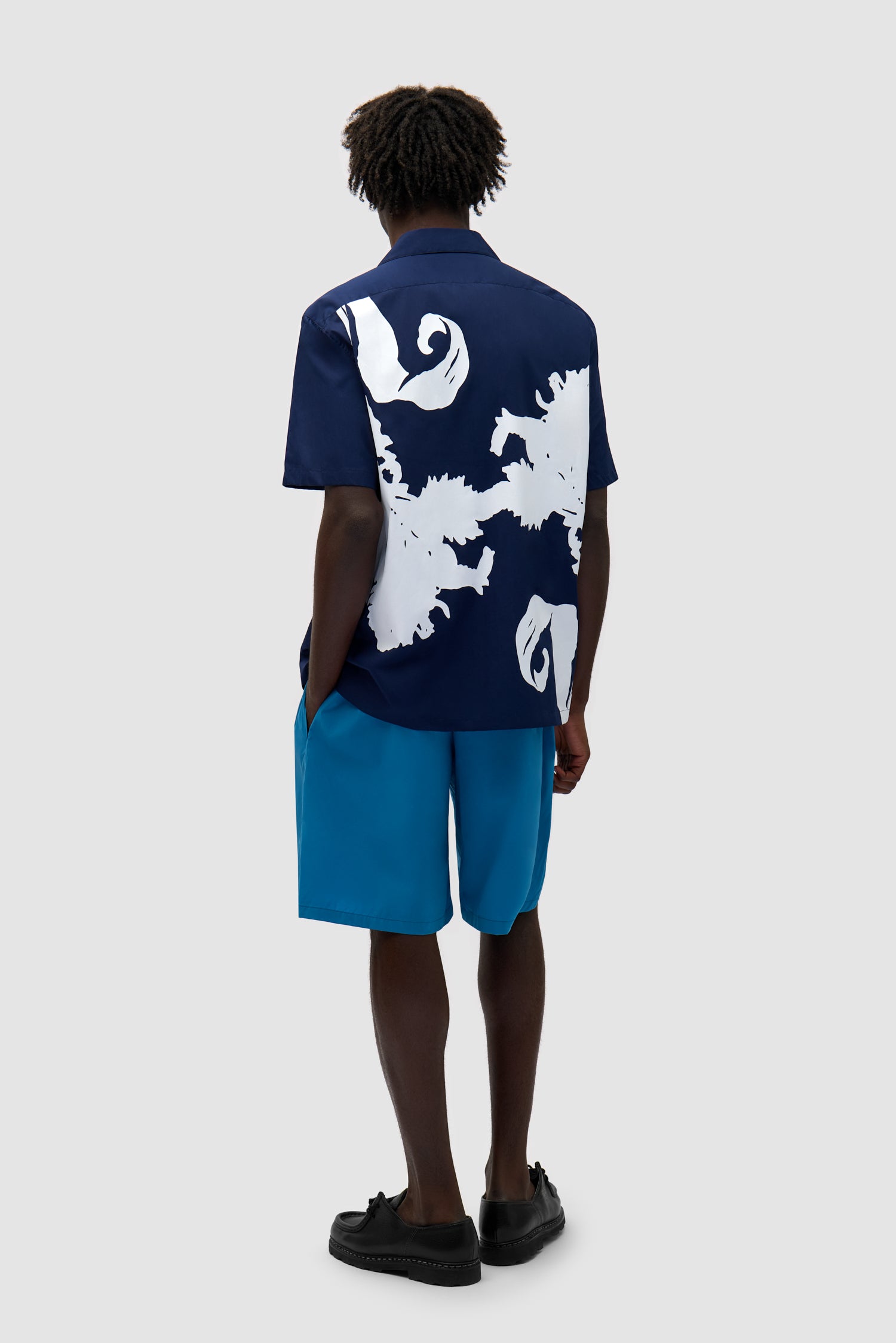 Big Flower Shirt in Navy/White worn by a model, full-body back view